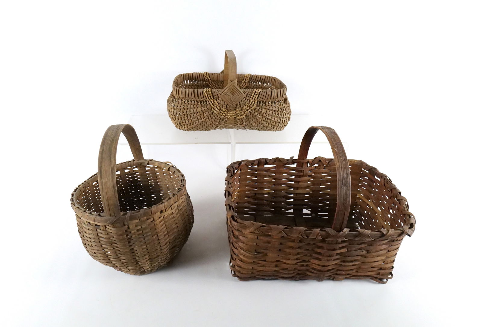 Lot of 3 Woven Baskets: Lot of 3 Woven Baskets. One marked LDH 98. Largest measures 14" tall x 17" wide. All invoices must be paid within 24 hours of the sale. We offer multiple shipping options, please read the shipping ter