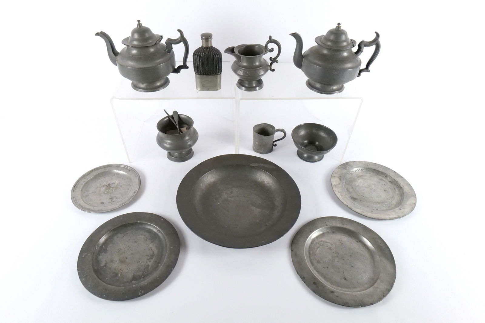 Lot of Pewter Items: Lot of Pewter Items. Including Tea Kettles, Plates, Large Round Platter, Creamer, Spirit Flask, and More. All invoices must be paid within 24 hours of the sale. We offer multiple shipping options,