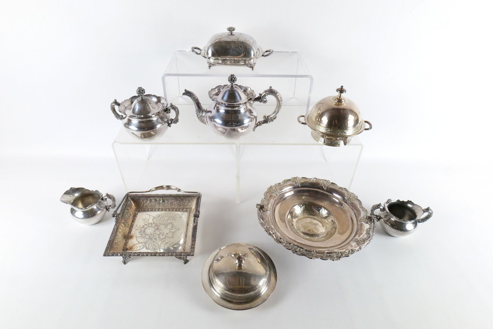Lot of Victorian Silverplate Serving Pieces: Lot of Victorian Silverplate Serving Pieces. Including Tea Kettle, Covered Dish, Basket Style Serving Dish, Creamer, Sugar, and More. Many Ornate and Etched. All invoices must be paid within 24 hours