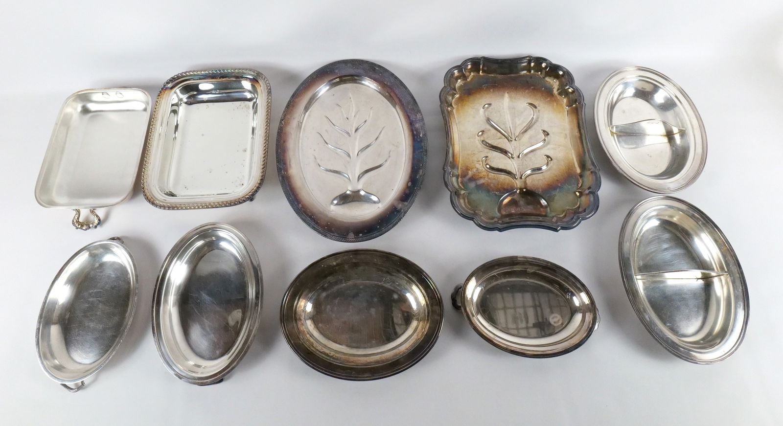 Lot of Silverplate Serving Dishes: Lot of Silverplate Serving Dishes. Including Serving Trays with Leaf Designs, Covered Entree Dishes - One marked NJ Flower and Garden Show, and More. All invoices must be paid within 24 hours of the s
