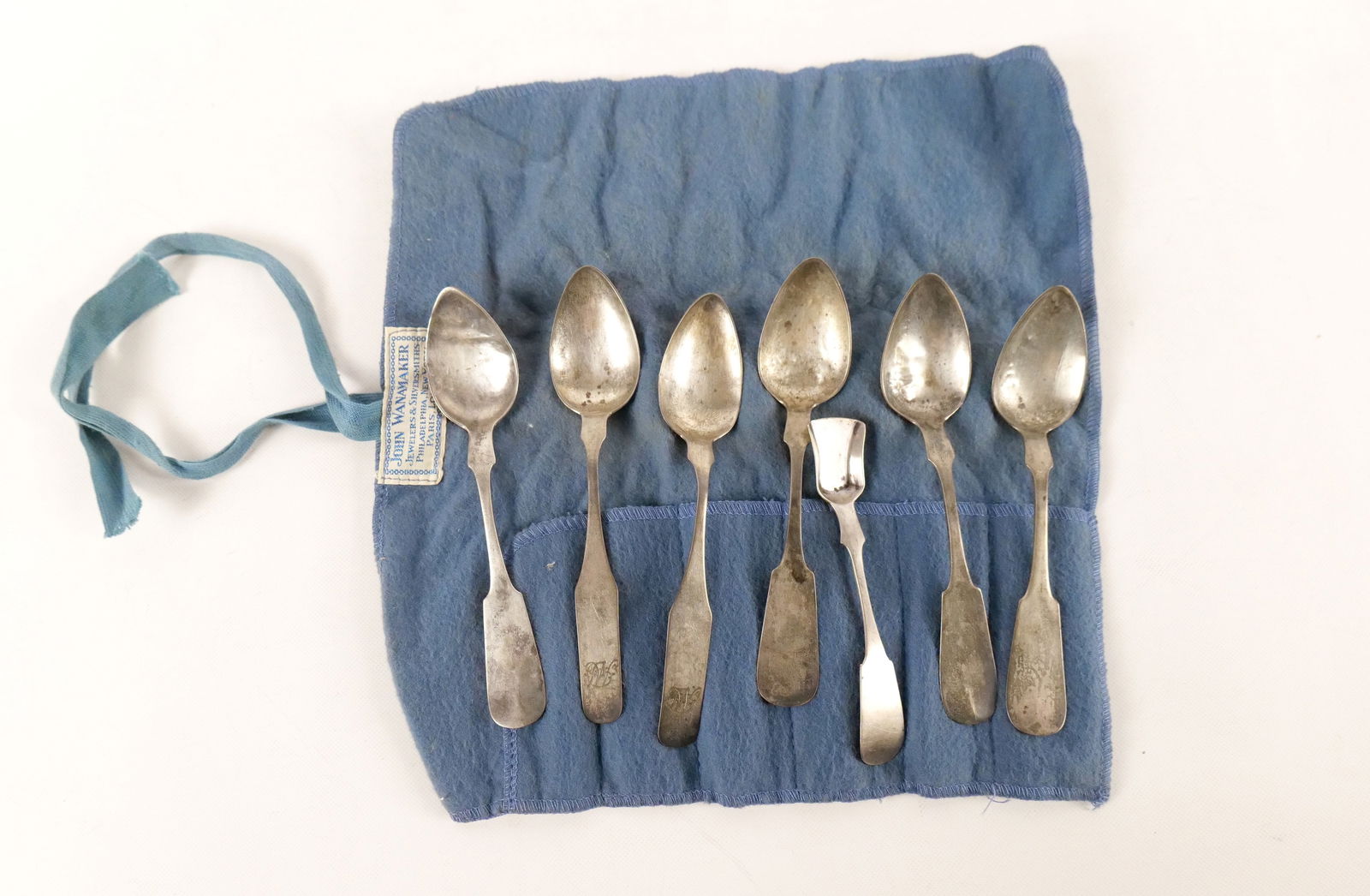 Lot of 7 Sterling Silver Pieces: Lot of 7 Sterling Silver Pieces. Including 2 x P. Garrett Monogramed, 4 Spoons - Marked Sterling (Dents), and Master Salt Spoon - Marked Zahm & Jackson. Weighs approx. 86.1 grams. All invoices must