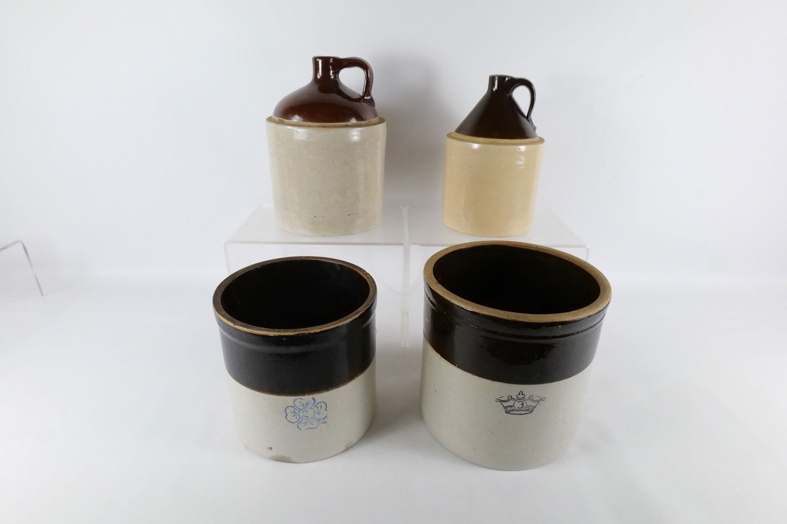 Lot of 4 Antique Two Tone Stoneware Jugs and Crocks: Lot of 4 Antique Two Tone Stoneware Jugs and Crocks. One Jug Marked Western Stoneware with Leaf Design, Other Crock Unmarked, One Crock Marked 3 in a Crown and Other marked 3 in a blue flower. Some mi