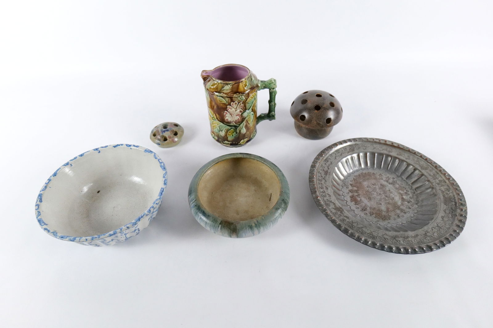 Group Lot of Mostly Pottery: Group Lot of Mostly Pottery. Including Majolica Pottery Pitcher with Dog Rose, Mushroom Pottery Flower Frog, Pottery Footed Bowl, Pottery Flower Frog, Spongeware Pottery Bowl, and Silver Etched Tray.
