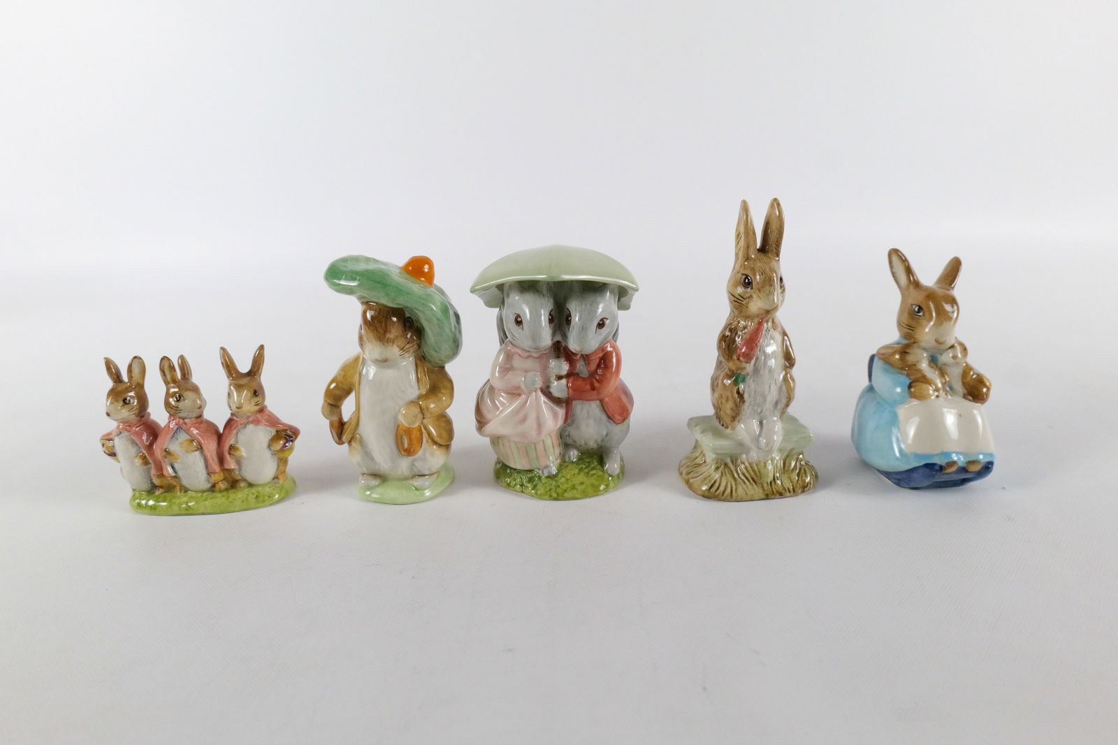 Lot of 5 Beswick England Beatrix Potter Figurines: Lot of 5 Beswick England Beatrix Potter Figurines. Including Flopsy, Mopsy and Cottontail, Goody and Timmy Tiptoes, Mrs. Rabbit and Bunnies, Fierce Bad Rabbit, and Benjamin Bunny. Two are artist signe