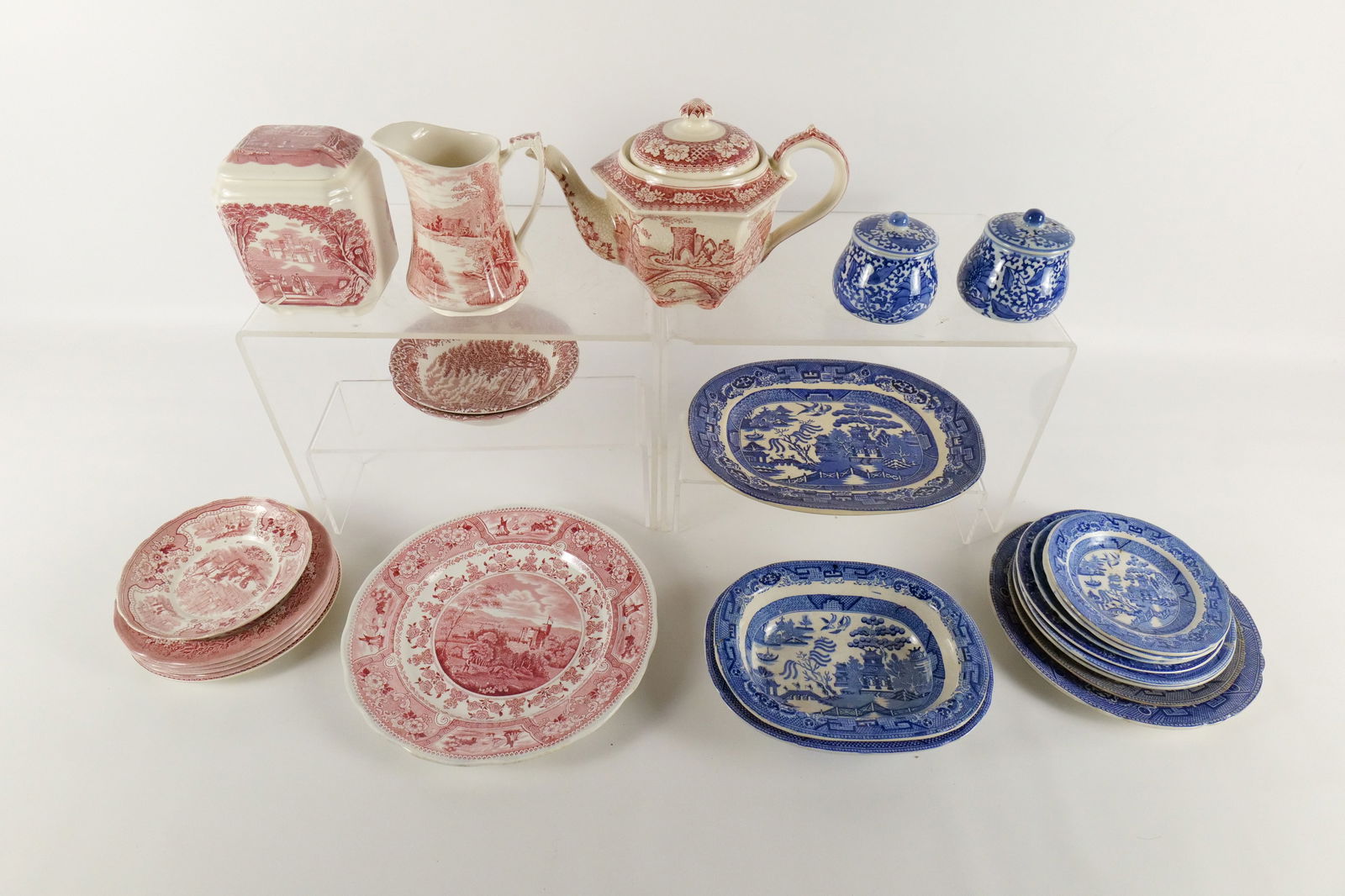 Group Lot of Ironstone Dishes: Group Lot of Ironstone Dishes. Including Blue and White and Red and White. Including Jonroth England, Wedgwood Stoneware, Staffordshire England Grindley & Co, and More. Some pieces have chipping, crac