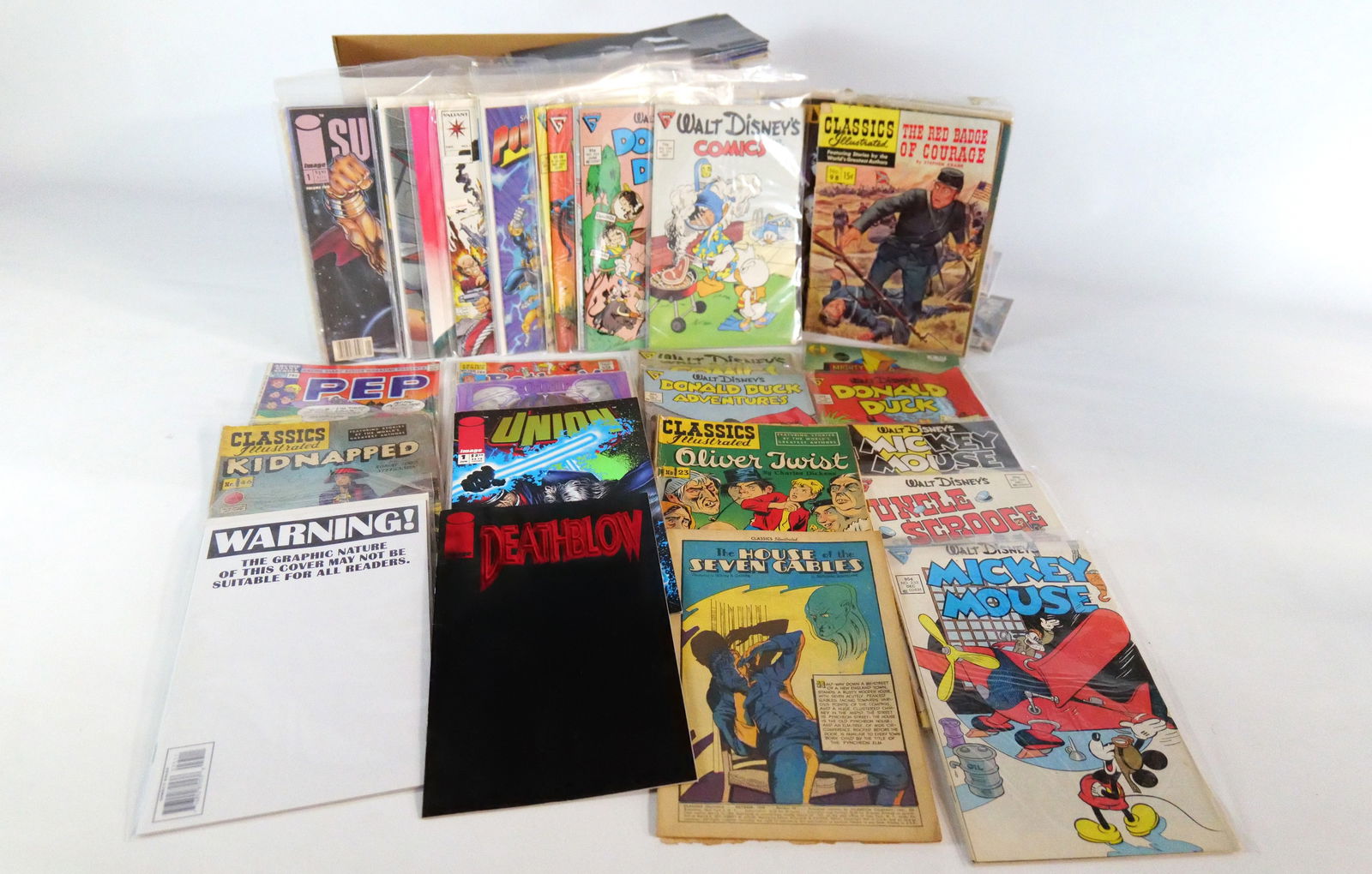 Short Box of Miscellaneous Independent Comics: Short Box of Miscellaneous Independent Comics. Including The Crow, Disney, Spawn, Rocketeer, Barb Wire, Xena, Buffy, The Simpsons and More. Average Grade is VG to Fine. Short Box is Full. Please note