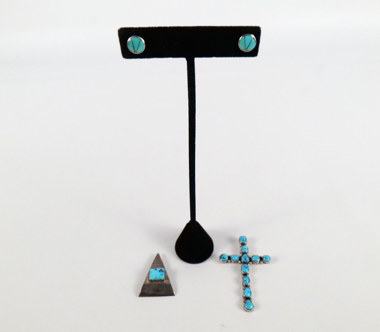 Lot of Sterling and Turquoise Jewelry: Lot of Sterling and Turquoise Jewelry. Including Cross Pendant measuring 2.25", Pair of Stud Earring, and Pin. All invoices must be paid within 24 hours of the sale. We offer multiple shipping options