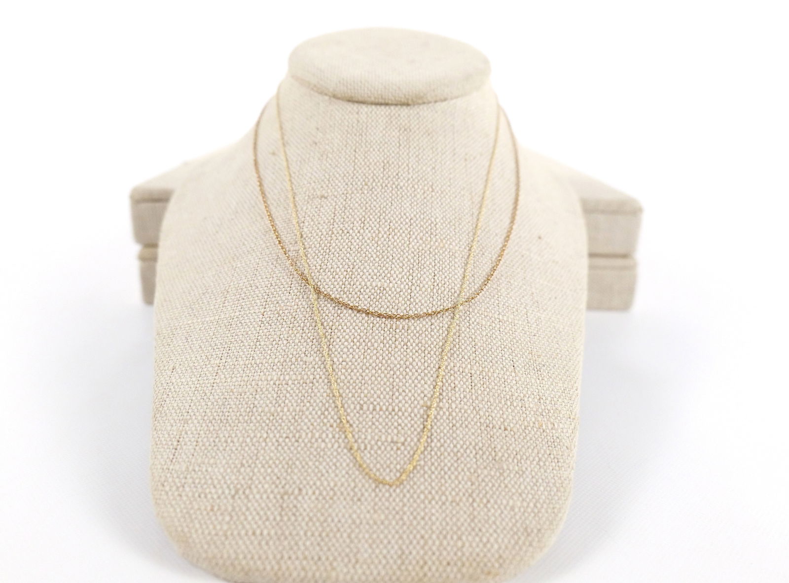 Pair of 10k Yellow Gold Chains: Pair of 10k Yellow Gold Chains. Largest measures 18". Weighs approx. 1.8 grams. All invoices must be paid within 24 hours of the sale. We offer multiple shipping options, please read the shipping term