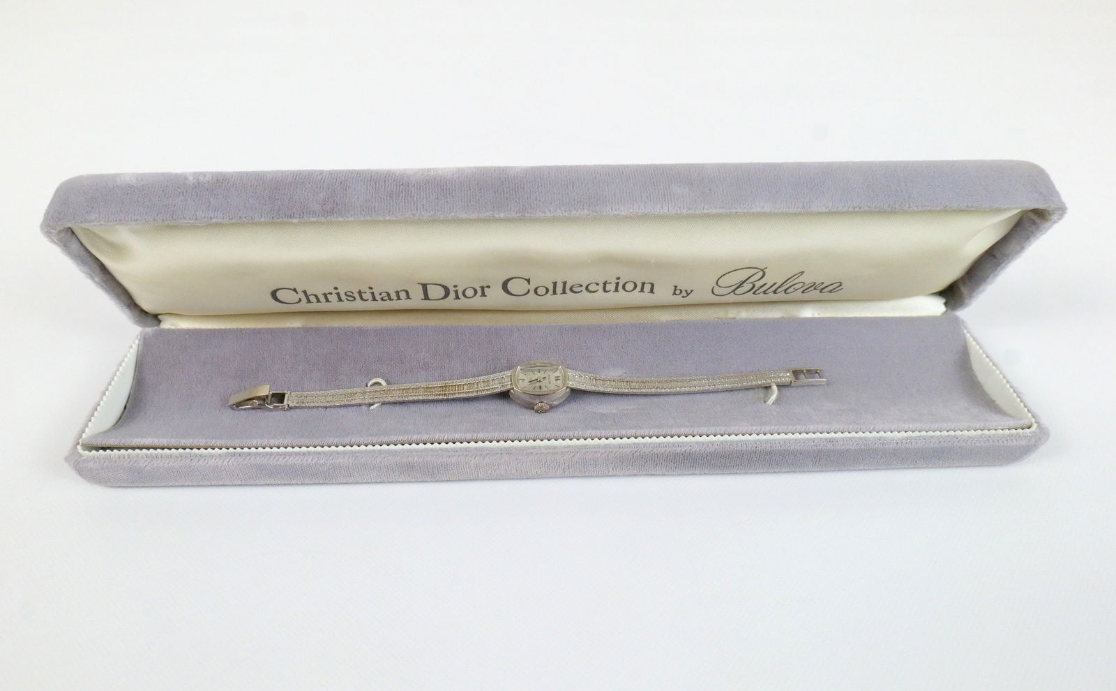 14k Bulova Christian Dior Woman's Watch: 14k Bulova Christian Dior Woman's Watch -White Gold. The band is also 14k. Comes with box. Measures 6 1/4". All invoices must be paid within 24 hours of the sale. We offer multiple shipping options, p