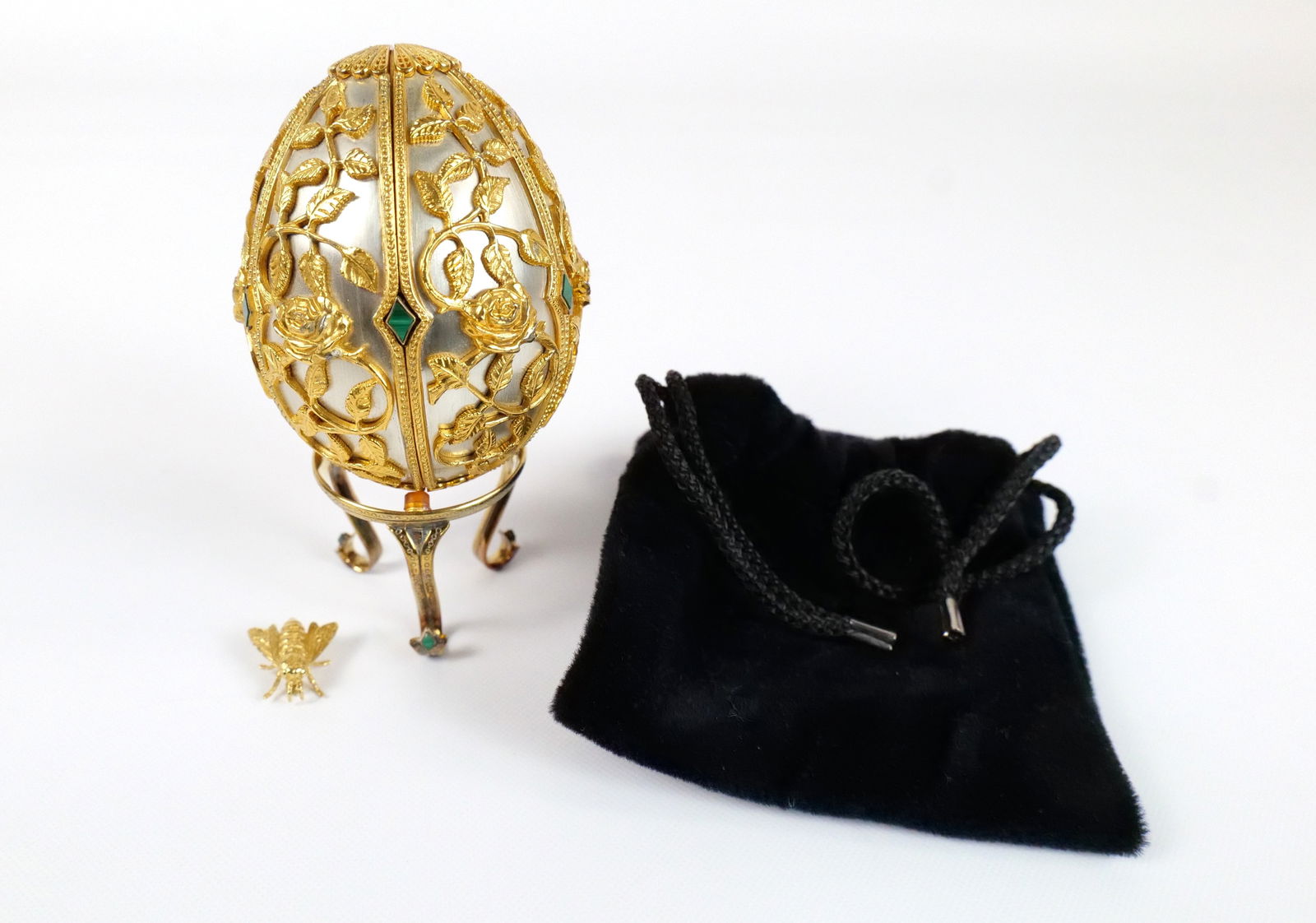 Sterling Silver and 18k Gold Egg with 18k Bee Pin: Franklin Mint House of Faberge Sterling Silver and 18k Gold Egg with Malachite. Also comes with 18k Bee Pin. Limited Edition of 750. Marked Sterling 1977. Base is also sterling. Measures 5" with stand