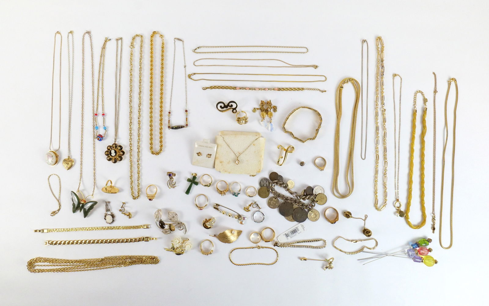 Lot of Gold Tone Jewelry: Lot of Gold Tone Jewelry. Including Mesh, Link, Rope Chains, Leaf Stud Earrings, Plastic Bead Stick Pins, Cameo Style Pendant in Flower, and More. All invoices must be paid within 24 hours of the sale