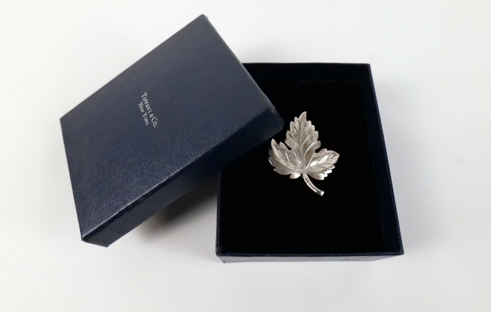 Tiffany & Co. Sterling Silver Leaf Brooch: Tiffany & Co. Sterling Silver Leaf Brooch. Measures 1 5/8". Comes in Tiffany box. All invoices must be paid within 24 hours of the sale. We offer multiple shipping options, please read the shipping te