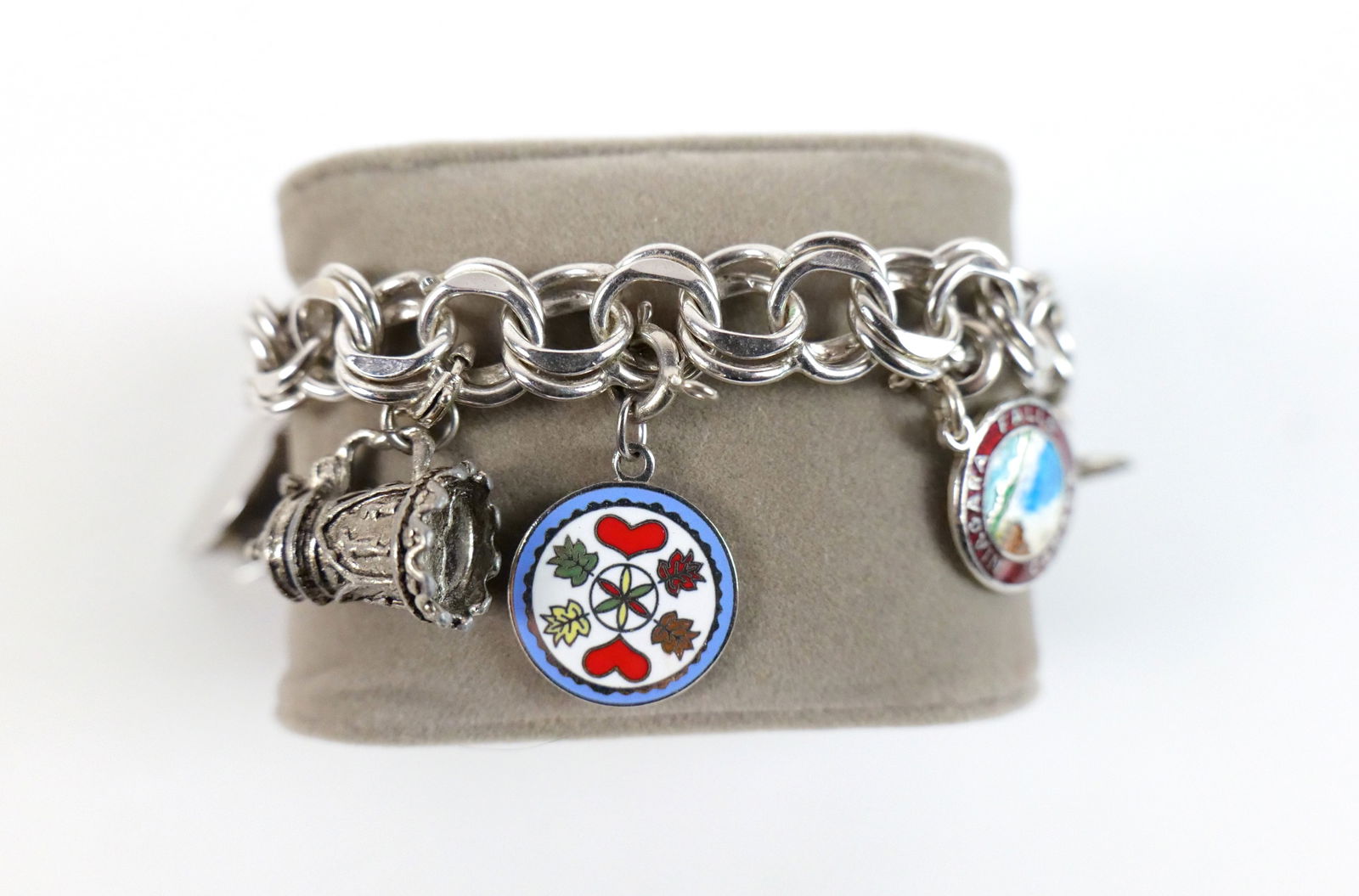 Sterling Silver Charm Bracelet: Sterling Silver Charm Bracelet. 3 Charms are Sterling, 3 are not. Measures 7 1/4" long. Safety Chain is broken and 2 charms have monograms. All invoices must be paid within 24 hours of the sale. We of