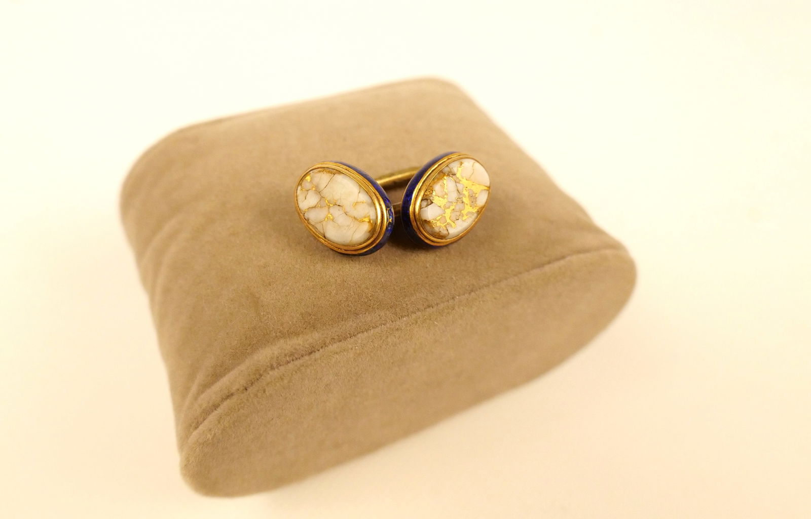 22k Single Cufflink: 22k Single Cufflink. Set with White and Gold Stone with Enamel on Edge. Wear to enamel. Some cracks to stone. All invoices must be paid within 24 hours of the sale. We offer multiple shipping options,