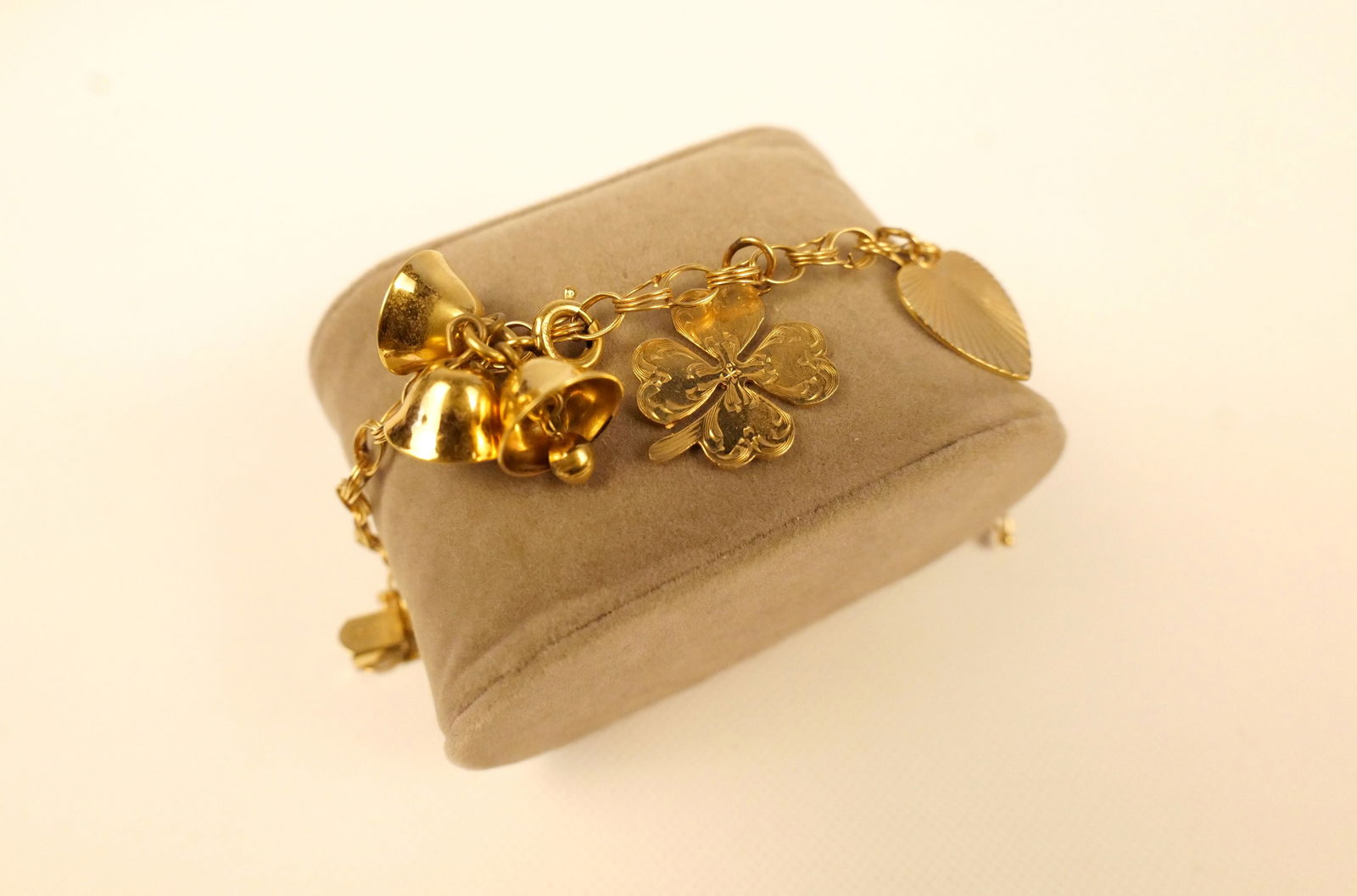 14k Charm Bracelet: 14k Charm Bracelet. Measures 6.25" long. Contains shamrock, heart and bells. Weighs approx. 9.8 grams. All invoices must be paid within 24 hours of the sale. We offer multiple shipping options,