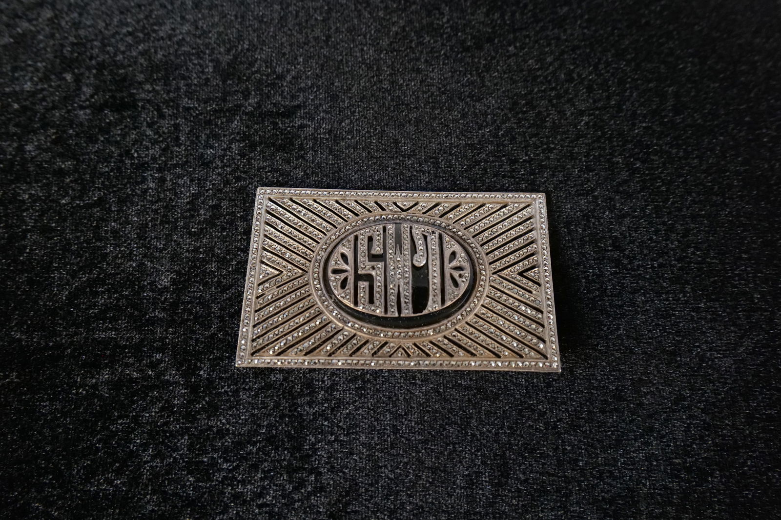 Sterling Silver and Marcasite Deco Monogrammed Pin: Sterling Silver and Marcasite Deco Monogrammed Pin. Initials L.M.S. Measures approx. 2 3/8" across. Missing some stones. All invoices must be paid within 24 hours of the sale. We offer multiple shippi