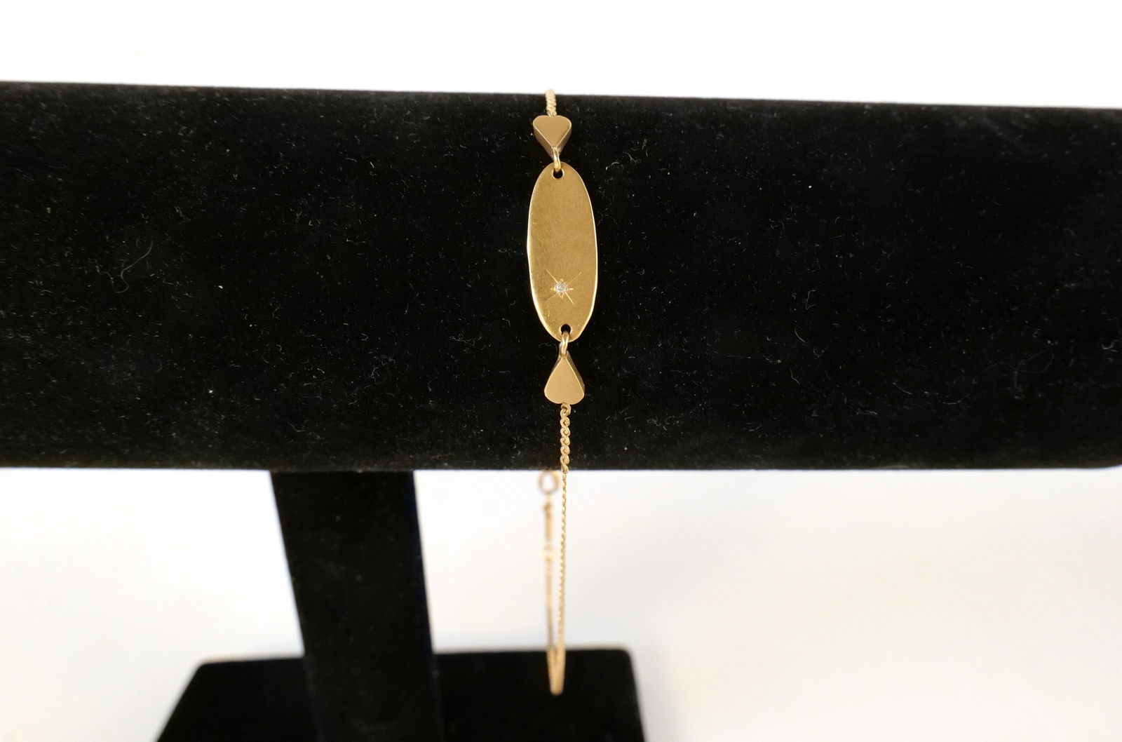 14k ID Bracelet: 14k ID Bracelet. Measures 9.5". Weighs approx. 2.2 grams. Set with very small stone. All invoices must be paid within 24 hours of the sale. We offer multiple shipping options, please read the shipping