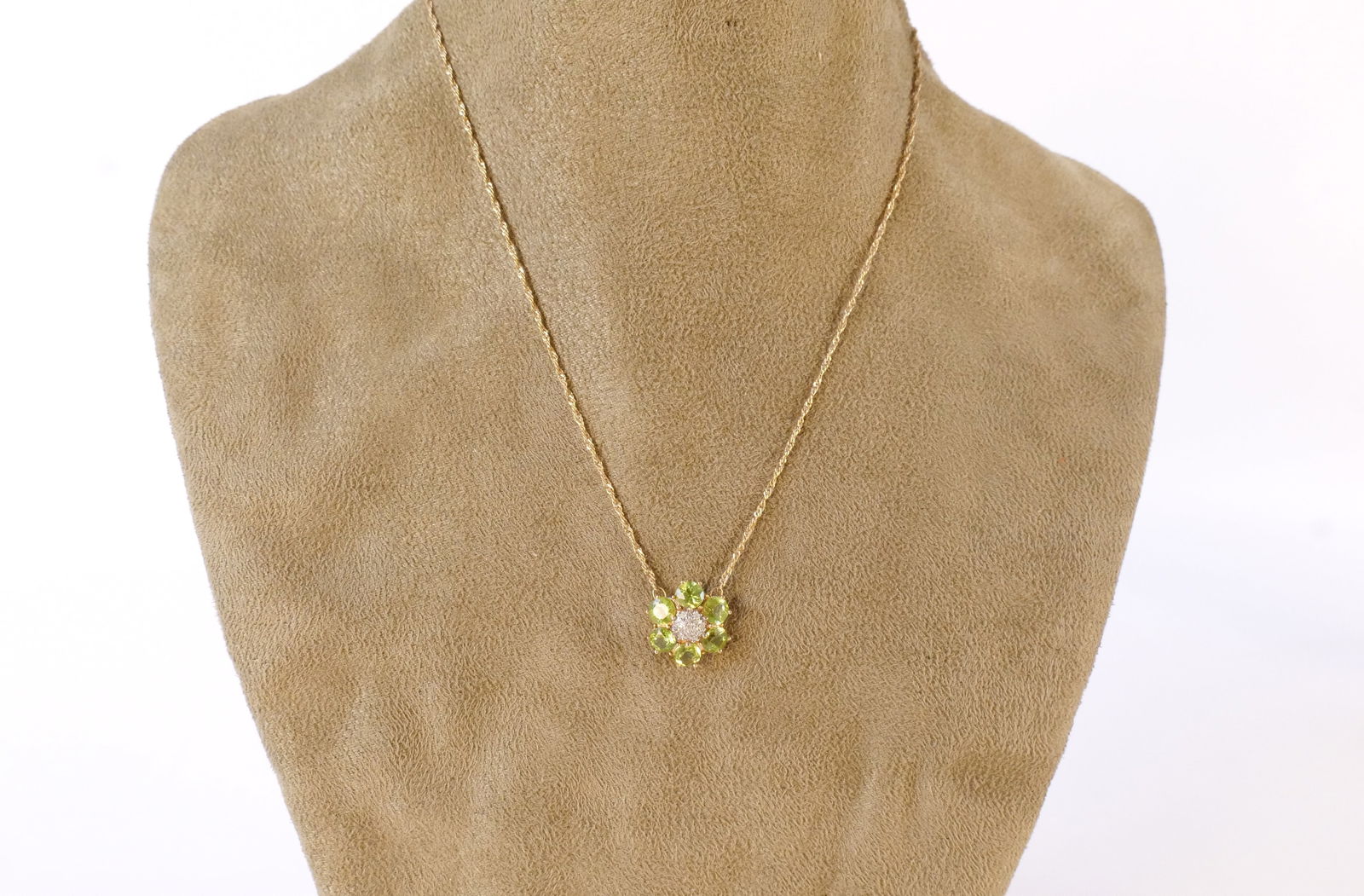 10k Diamond and Peridot Flower Pendant Necklace: 10k Diamond and Peridot Flower Pendant Necklace. Measures 16". All invoices must be paid within 24 hours of the sale. We offer multiple shipping options, please read the shipping terms to understand y