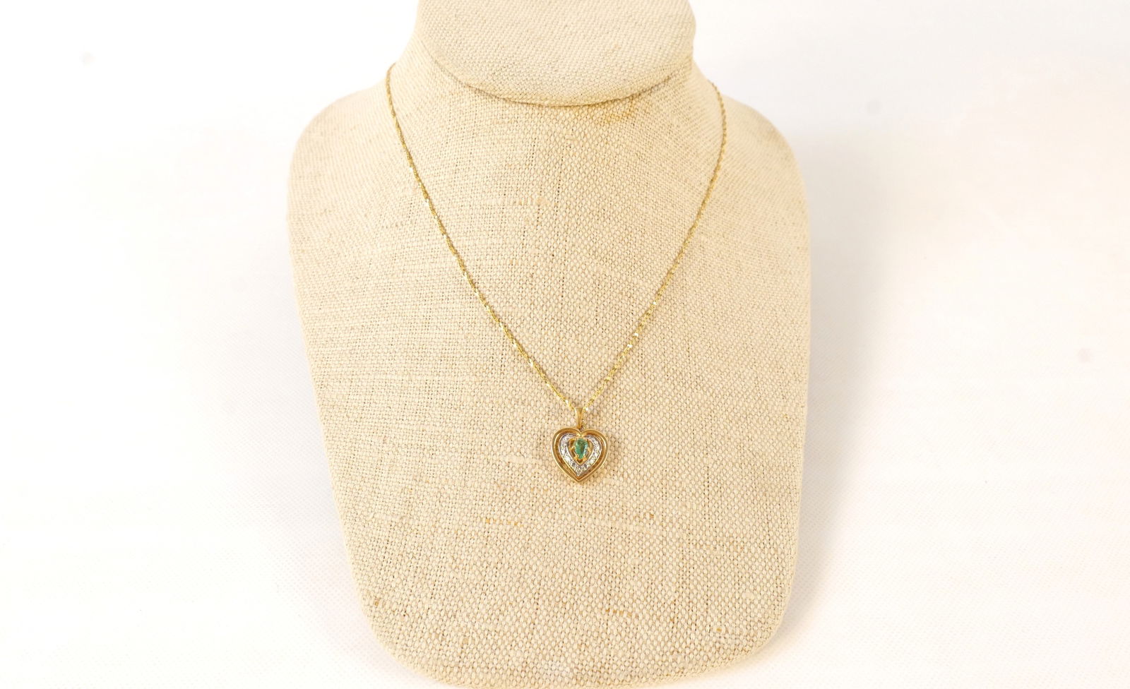 14k Yellow Gold Heart Pendant Necklace: 14k Yellow Gold Heart Pendant Necklace. Set with Emerald and Diamond Chips. Measures 20". All invoices must be paid within 24 hours of the sale. We offer multiple shipping options, please read the shi