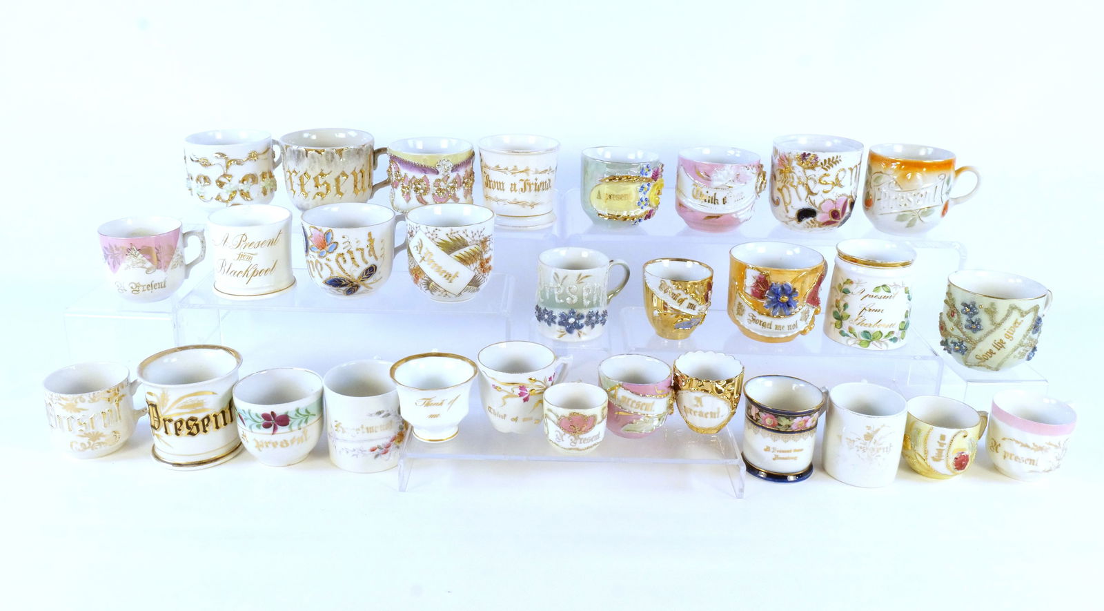 Lot of 25+ Souvenir Cups: Lot of 25+ Souvenir Cups. Victorian Era - 1950's. Including Present, Think of Me, Love the Giver, Forget Me Not, and More. Tallest measures approx. 3.5". Some chips and wear to the paint on some of th