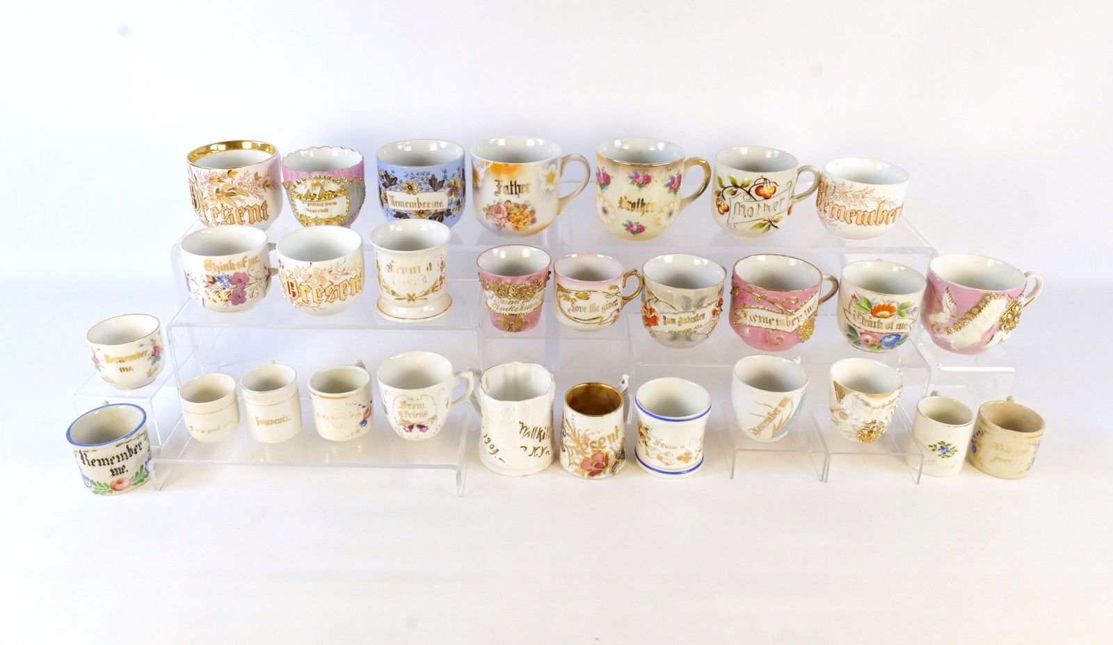 Lot of 25+ Souvenir Cups: Lot of 25+ Souvenir Cups. Victorian Era - 1950's. Including Think of Me, Remember Me, Present, Mother, Father, and More. Tallest measures approx. 3.5". Some chips and wear to the paint on some of the