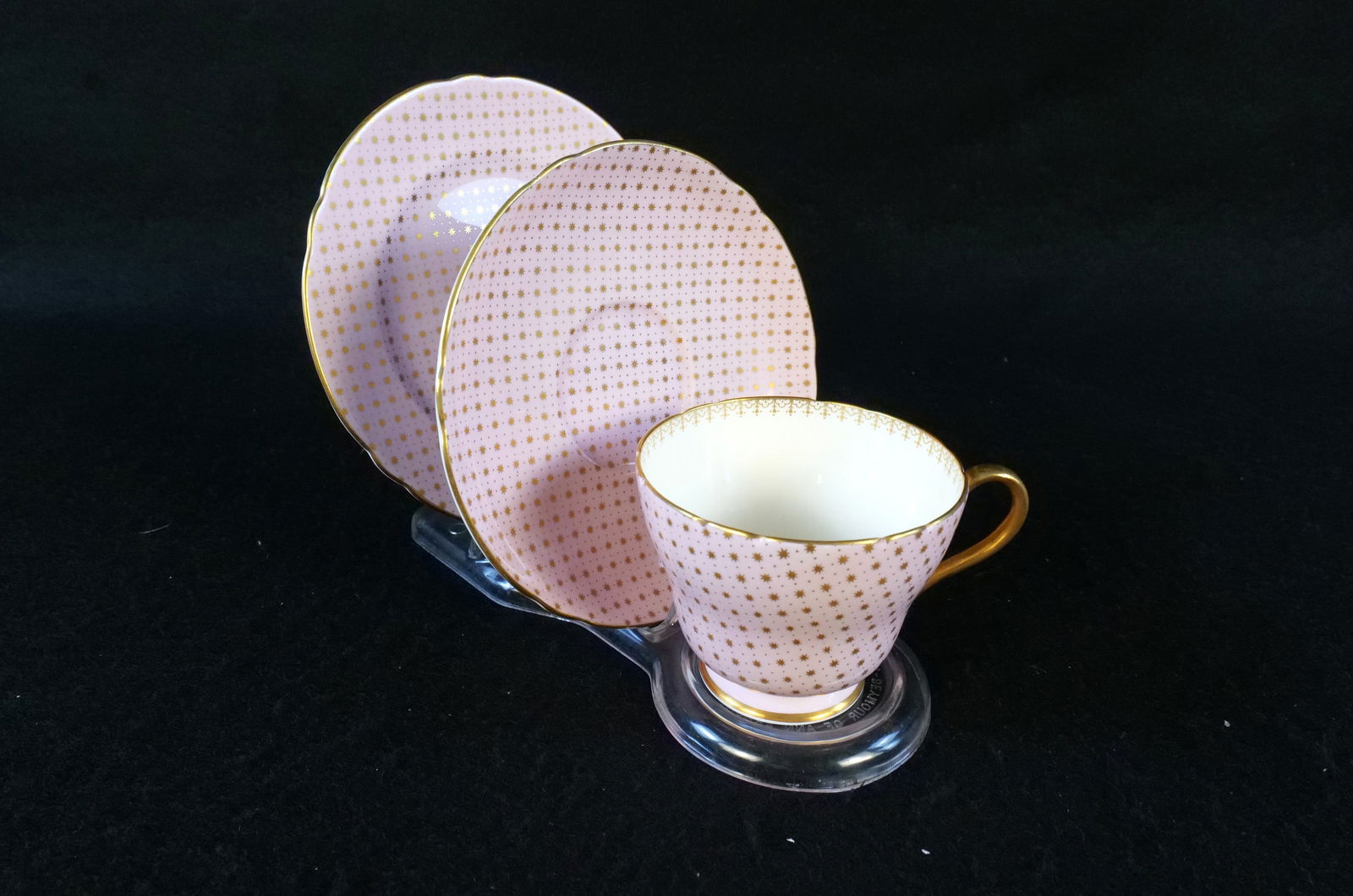 Lot of Shelley Pink Gold Stars Gold Rimmed Bone China Pieces: Lot of Shelley Pink Gold Stars Gold Rimmed Bone China Pieces. Including Teacup, Saucer, and 6" Plate. Good Condition. All invoices must be paid within 24 hours of the sale. We offer multiple shipping