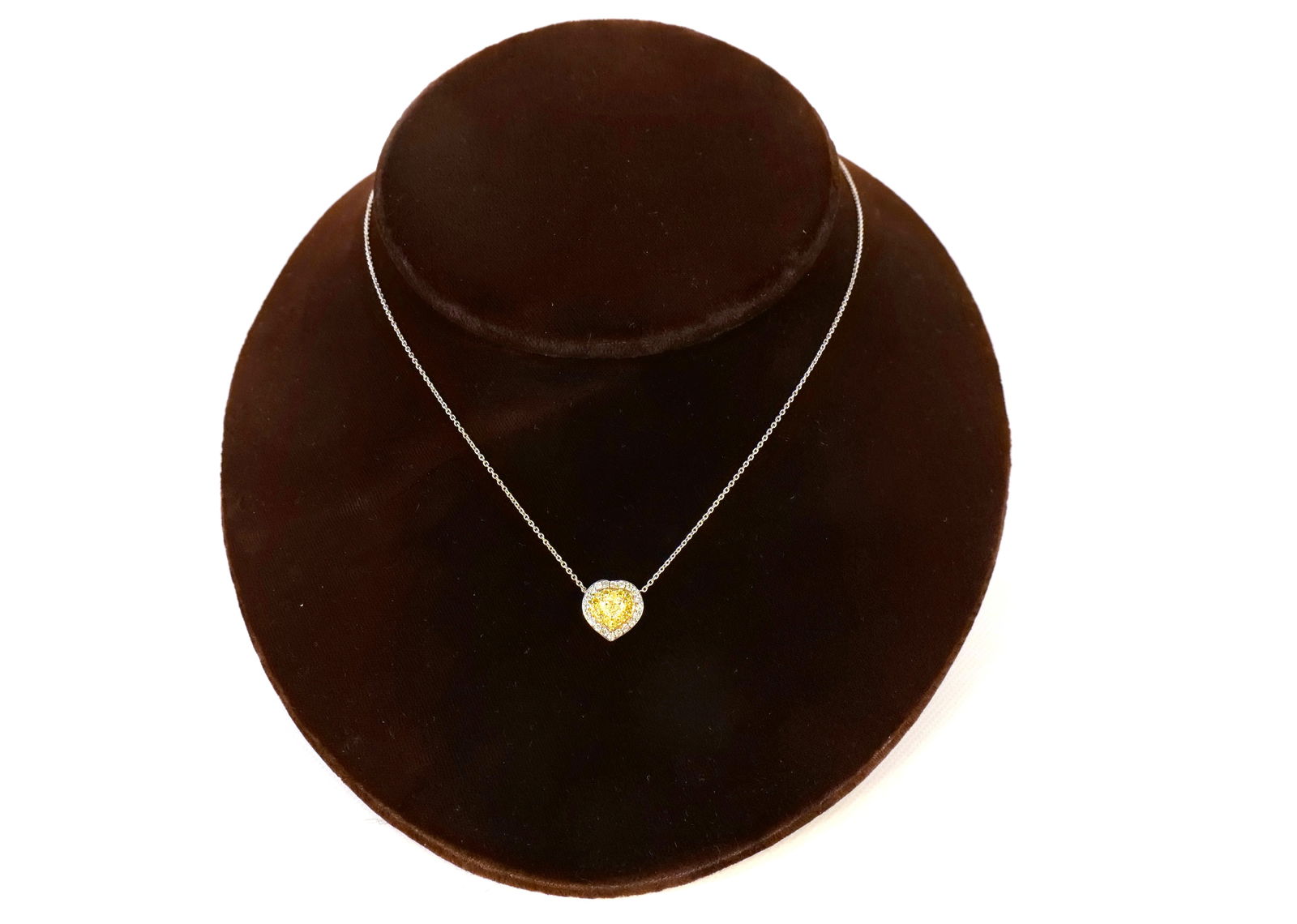 14K Yellow Gold and Diamond Necklace: 14K Yellow Gold and Diamond Necklace. Diamonds are clear and fancy yellow in a heart shape. Total diamond weight is approx. .75 carat. Chain measures 18" long. Total weight of necklace is 2.5 grams. C