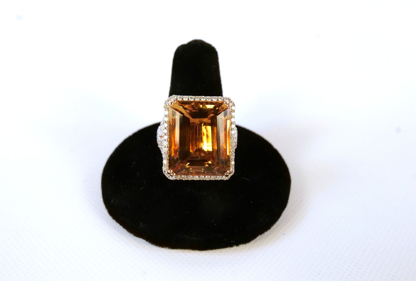 14K Rose Gold Morganite and Diamond Ring: 14K Rose Gold Morganite and Diamond Ring. Morganite weighs approx. 16.60 carats. Diamond weight is .85 carat. Total weight of the ring is 10.5 grams. Ring Size 7.5. Comes with GGA Report. All invoices