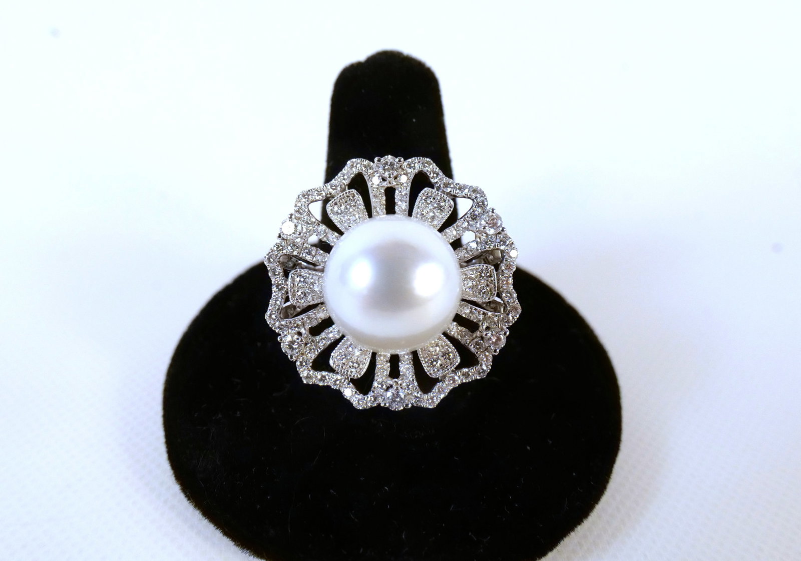Platinum South Sea Pearl and Diamond Ring: Platinum South Sea Pearl and Diamond Ring. Pearl measures 13.15 mm. Diamond weight is 1.46 carat. Total Ring weight is 13.7 grams. Ring Size 6.75. Comes with a GGA and GIA Report. All invoices must be