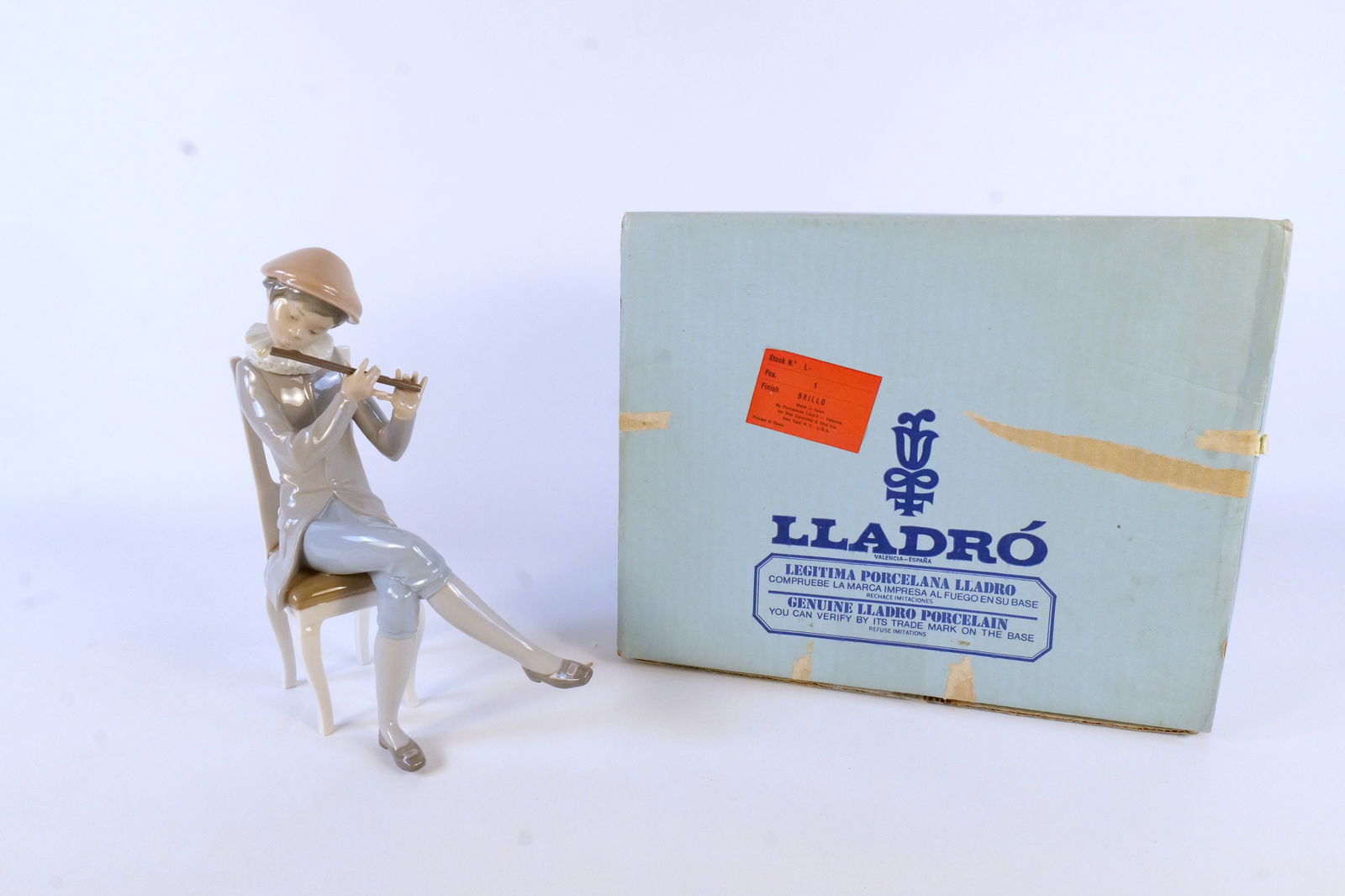 Lladro Boy Playing Flute Figurine: Lladro Boy Playing Flute #877. Measures 10" tall x 7" wide. Comes with Box. All invoices must be paid within 24 hours of the sale. We offer multiple shipping options, please read the shipping terms to