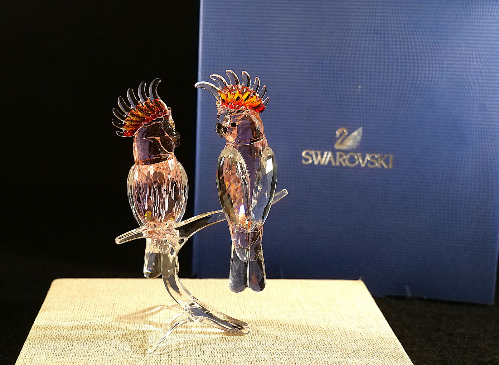 Swarovski Paradise Collection Pink Cockatoo Pair: Swarovski Crystal Paradise Collection Pink Cockatoo Pair. Made with Pink and Clear Crystal. Hard to Find! Measures 6.5" tall x 5" wide. Comes with original box. All invoices must be paid within 24 hou