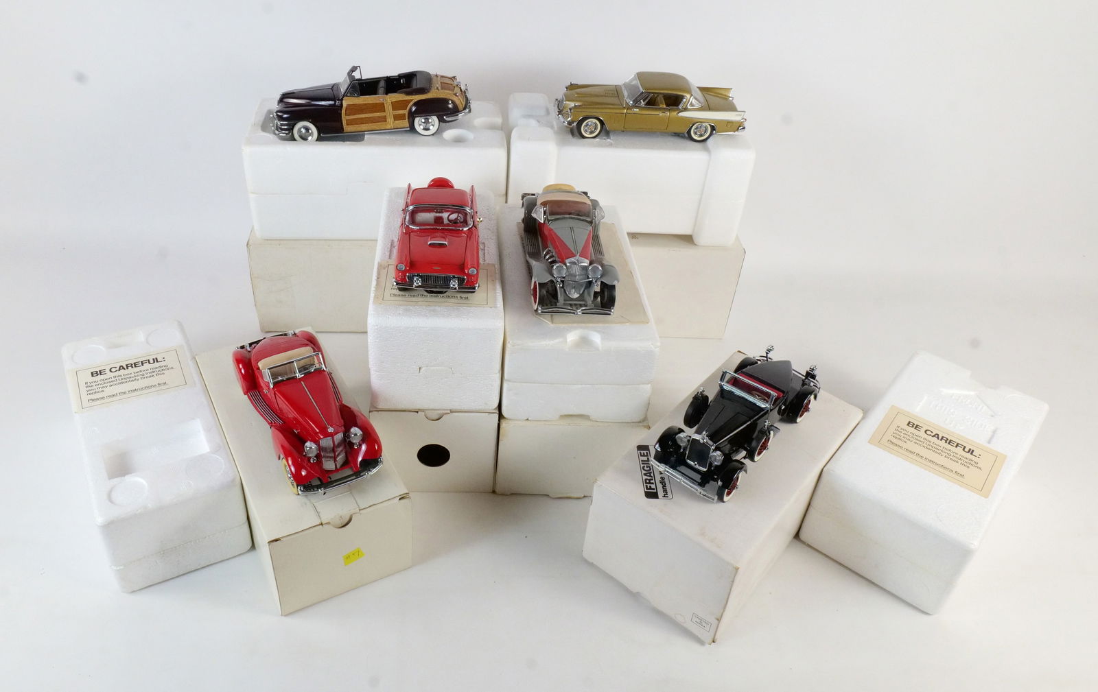 Lot of 6 Danbury Mint Diecast Cars 1:24 Scale: Lot of 6 Danbury Mint Diecast Cars 1:24 Scale. Including 1935 Duesenberg SSI, 1948 Crysler Town & Country, 1957 Studebaker Golden Hawk, 1927 Stutz Black Hawk, 1934 Packard V-12 Lebaron Speedster, and