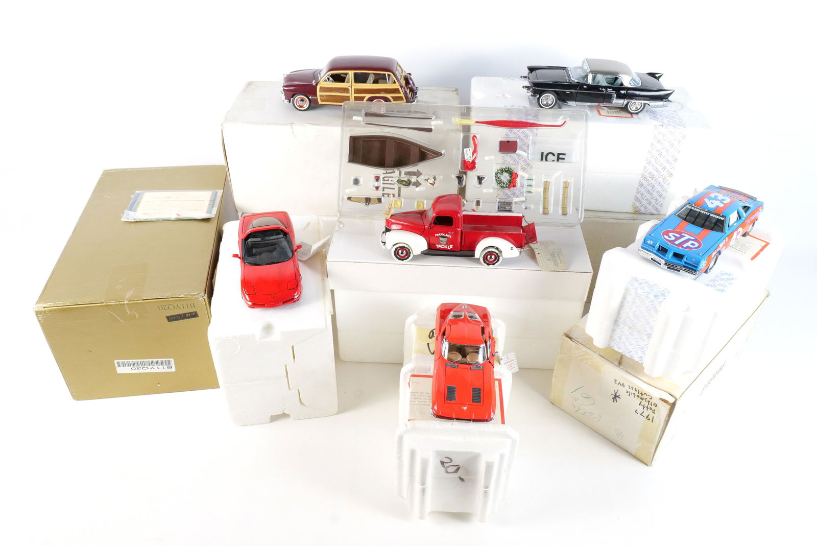 Lot of 6 Franklin Mint Diecast Cars 1:24 Scale: Lot of 6 Franklin Mint Diecast Cars 1:24 Scale. Including 1999 Christmas Truck, 1957 Cadillac Eldorado, 1997 Corvette, 1963 Corvette, Richard Petty Race Car, and 1949 Ford Woody Wagon. Full Disclosure