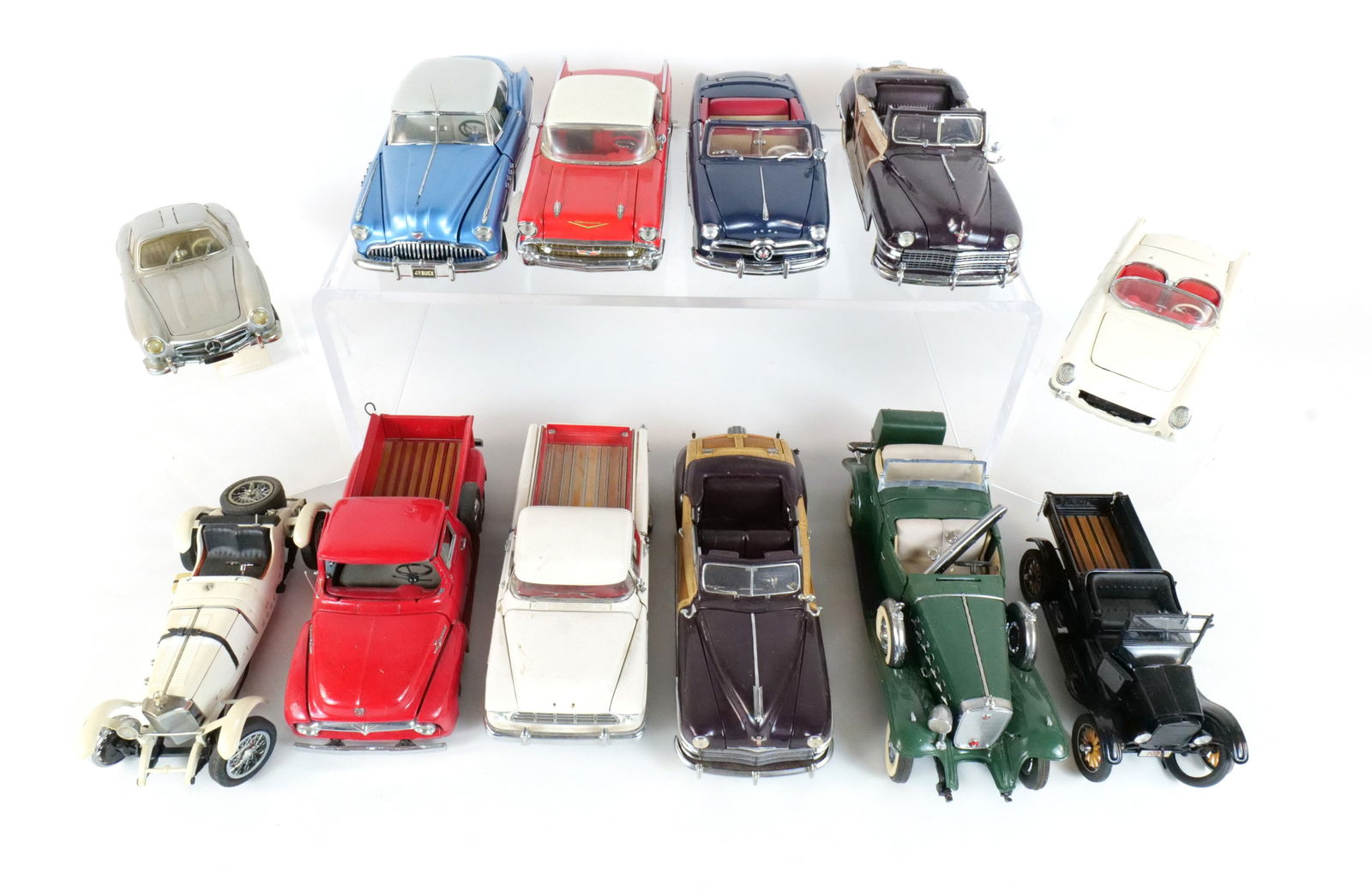 Lot of 12 Assorted Diecast Cars 1:24: Lot of 12 Assorted Diecast Cars 1:24. Franklin and Danbury Mint. Lot includes a Red 1957 Chevrolet Bel Air, a Blue 1949 Buick Riviera, a White 1955 Chevrolet Cameo Pickup, a Blue 1949 Ford Convertible
