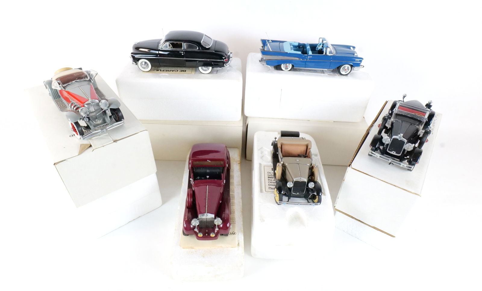Lot of 6 Danbury Mint Diecast Cars 1:24 Scale: Lot of 6 Danbury Mint Diecast Cars 1:24 Scale. Lot includes a Black 1949 Mercury Club Coupe, a Gray 1935 Duesenberg SSJ, a Black 1927 Stutz Blackhawk, a Gray 1931 Ford Model A, a Red 1938 Rolls Royce