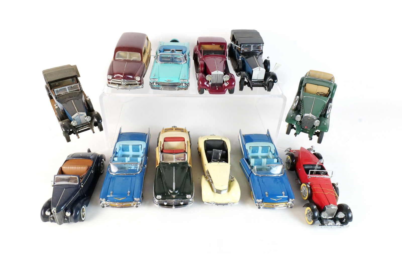 Lot of 12 Assorted Diecast Cars 1:24 Scale: Lot of 12 Assorted Diecast Cars 1:24. Franklin and Danbury Mint. Lot includes a Turquoise 1958 Chevrolet Impala, a Green 1932 Cadillac V-16, a Blue 1957 Chevrolet Bel Air, a Blue 1929 Rolls Royce Phan