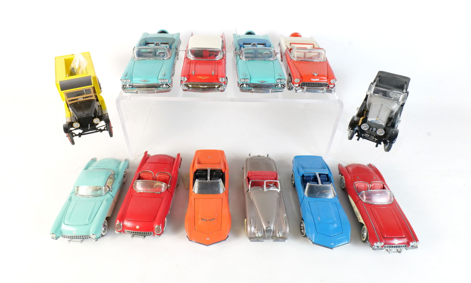 Lot of 12 Assorted Diecast Cars 1:24 Scale: Lot of 12 Assorted Diecast Cars 1:24. Franklin and Danbury Mint. Lot includes a Yellow 1927 Coca-Cola Delivery Truck, a Red and White 1955 Chevrolet Bel-air, an Orange 1969 Corvette, a Red 1954 Corvet