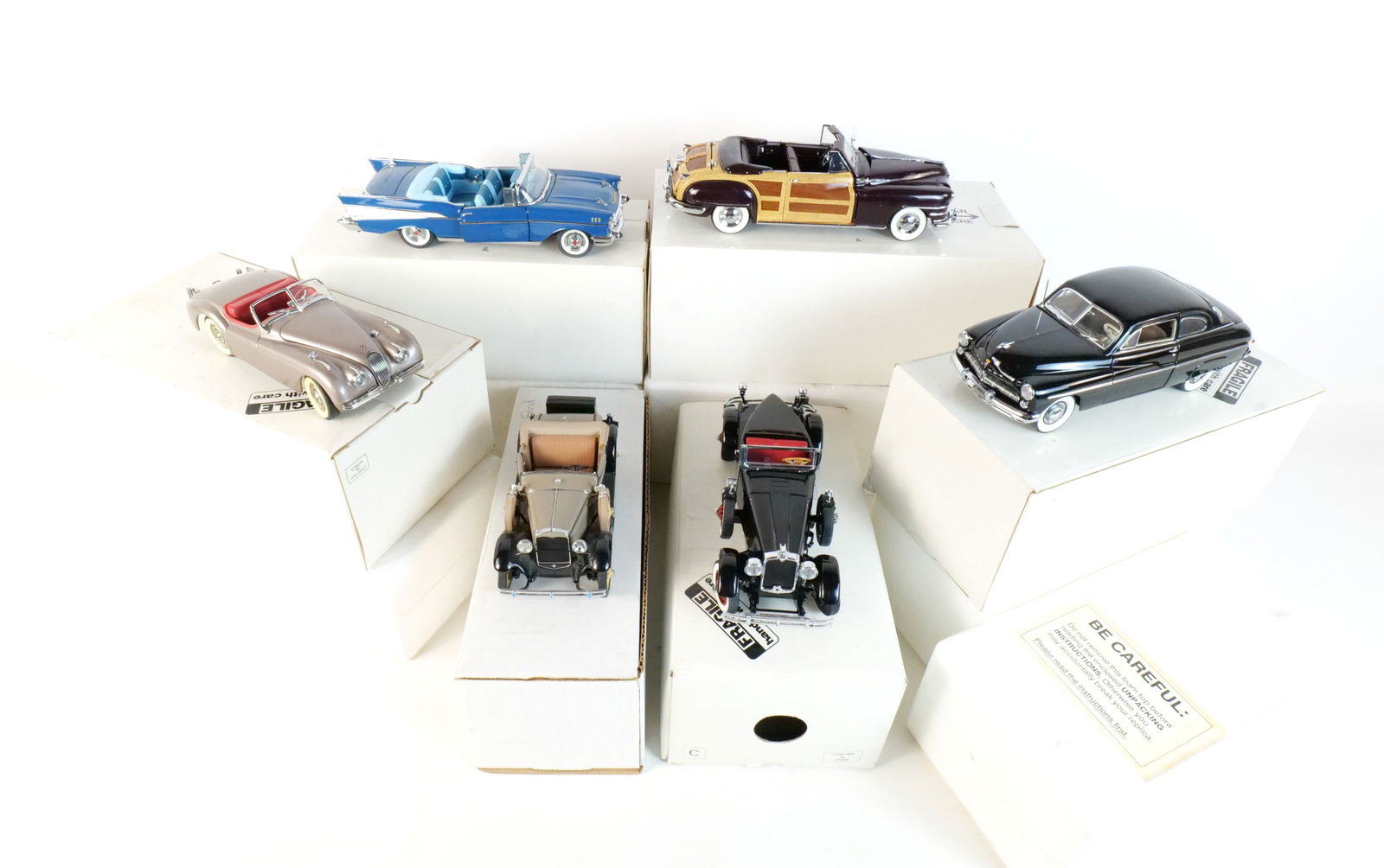 Lot of 6 Danbury Mint Diecast Cars 1:24 Scale: Lot of 6 Danbury Mint Diecast Cars 1:24 Scale. Lot includes a Black 1927 Stutz Black Hawk, a Silver 1949 Jaguar XK120, a Blue 1957 Chevrolet Bel Air, a Tan 1931 Ford Model A, a Black 1949 Mercury Club