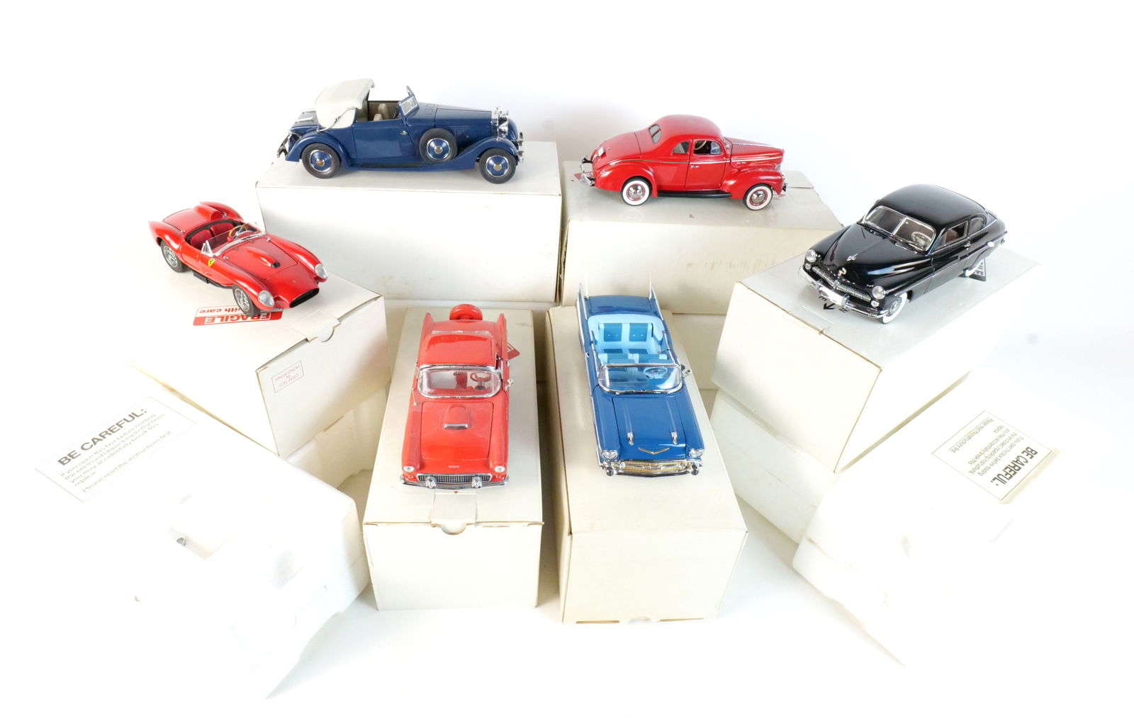 Lot of 6 Danbury Mint Diecast Cars 1:24 Scale: Lot of 6 Danbury Mint Diecast Cars 1:24 Scale. Lot includes a Red 1940 Ford Deluxe Coupe, a Black 1949 Mercury Club Coupe, a Red 1958 Ferrari 250 Testa Rossa, a Red 1956 Ford Thunderbird, a Blue 1934