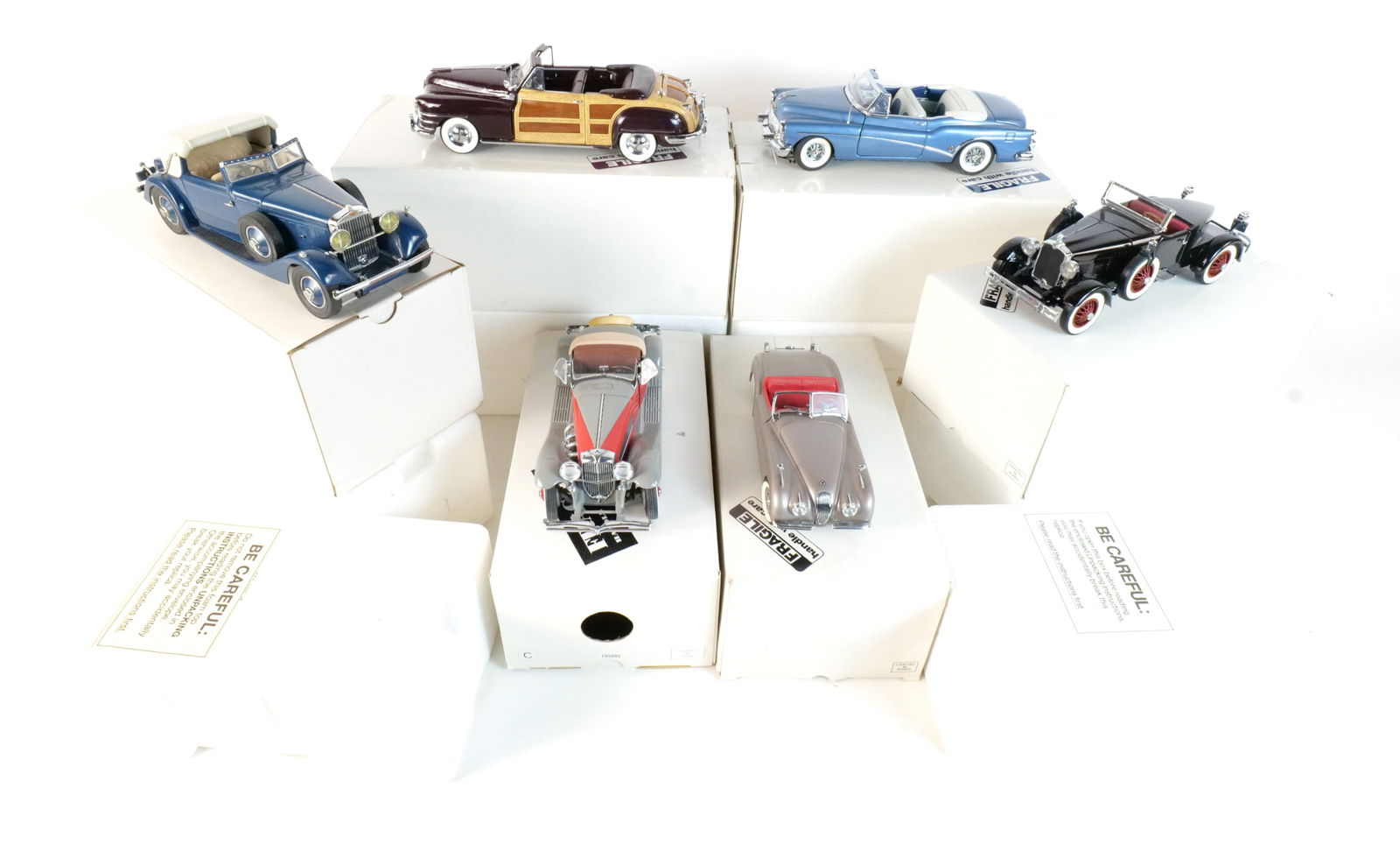 Lot of 6 Danbury Mint Diecast Cars 1:24 Scale: Lot of 6 Danbury Mint Diecast Cars 1:24 Scale. Lot includes a Blue 1953 Buick Skylark, a Gray and Red 1935 Duesenberg SSJ, a 1948 Chrysler Town and country, a Black 1927 Stutz Blackhawk, a Blue 1934 H
