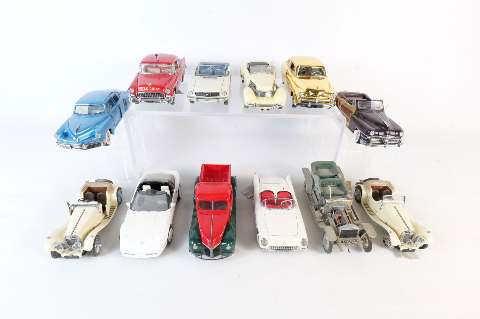 Lot of 12 Assorted 1:24 Scale Diecast Cars: Lot of 12 Assorted 1:24 Scale Diecast Cars. Mostly Franklin and Danbury Mint. Including 1953 Corvette, 1955 Chevrolet Bel Air, 1988 Corvette, 1948 Tucker, 1965 Ford Mustang and More. Full Disclosure -
