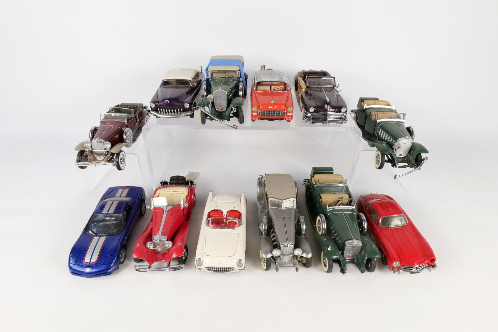 Lot of 12 Assorted 1:24 Scale Diecast Cars: Lot of 12 Assorted 1:24 Scale Diecast Cars. Mostly Franklin and Danbury Mint. Including 1930 Duesenberg, 1950 Mercury Custom, 1954 Mercedes 300 SL, 2004 Corvette, 1955 Chevrolet Bel Air, and More. Ful