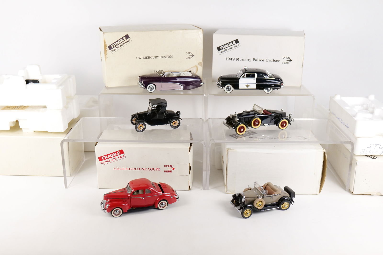 Lot of 6 Danbury Mint 1:24 Scale Diecast Cars: Lot of 6 Danbury Mint 1:24 Scale Diecast Cars. Including 1940 Ford Deluxe Coupe, 1931 Ford Model A, 1925 Ford Model T, 1949 Mercury Police Cruiser, 1950 Mercury Custom, and 1927 Stutz Black Hawk. Full