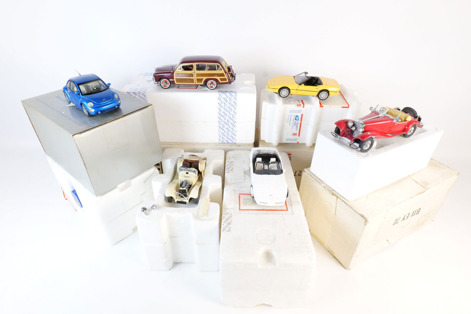 Lot of 6 Franklin Mint 1:24 Scale Diecast Cars: Lot of 6 Franklin Mint 1:24 Scale Diecast Cars. Including 1986 Corvette, Mercedes 500K Special Roadster, 1988 Corvette, 1938 Jaguar, VW New Beetle, 1949 Ford Woody Wagon, and 1988 Corvette. Full Discl