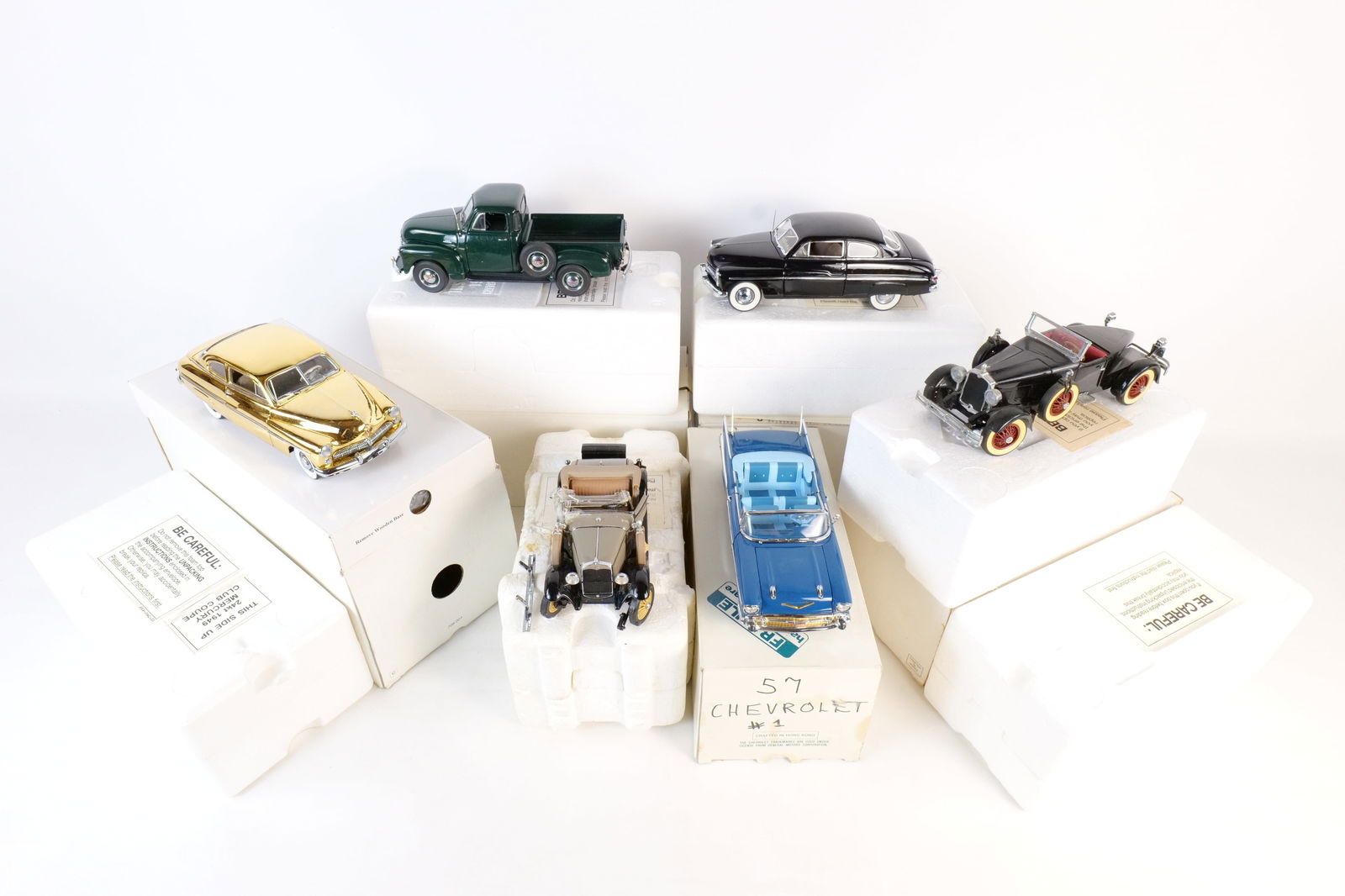 Lot of 6 Danbury Mint 1:24 Scale Diecast Cars: Lot of 6 Danbury Mint 1:24 Scale Diecast Cars. Including 1953 Chevrolet Pickup, 1957 Chevrolet Bel Air, 1949 Mercury Club Coupe, 1922 Stutz Black Hawk, and 1949 Gold Mercury Club Coupe, and 1931 Model