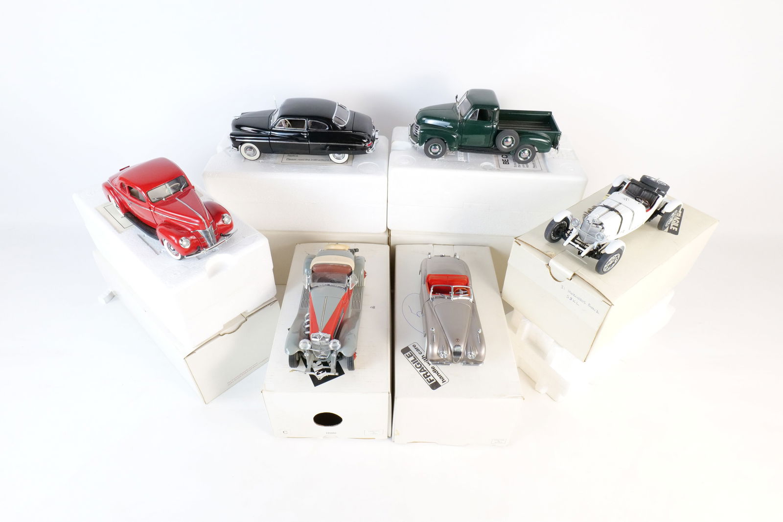 Lot of 6 Danbury Mint 1:24 Scale Diecast Cars: Lot of 6 Danbury Mint 1:24 Scale Diecast Cars. Including 1931 Mercedes Benz SSKL, 1935 Duesenberg SSJ, 1949 Jaguar XK120, 1940 Deluxe Ford Coupe, 1949 Mercury Club Coupe, and 1953 Chevrolet Pick Up. F