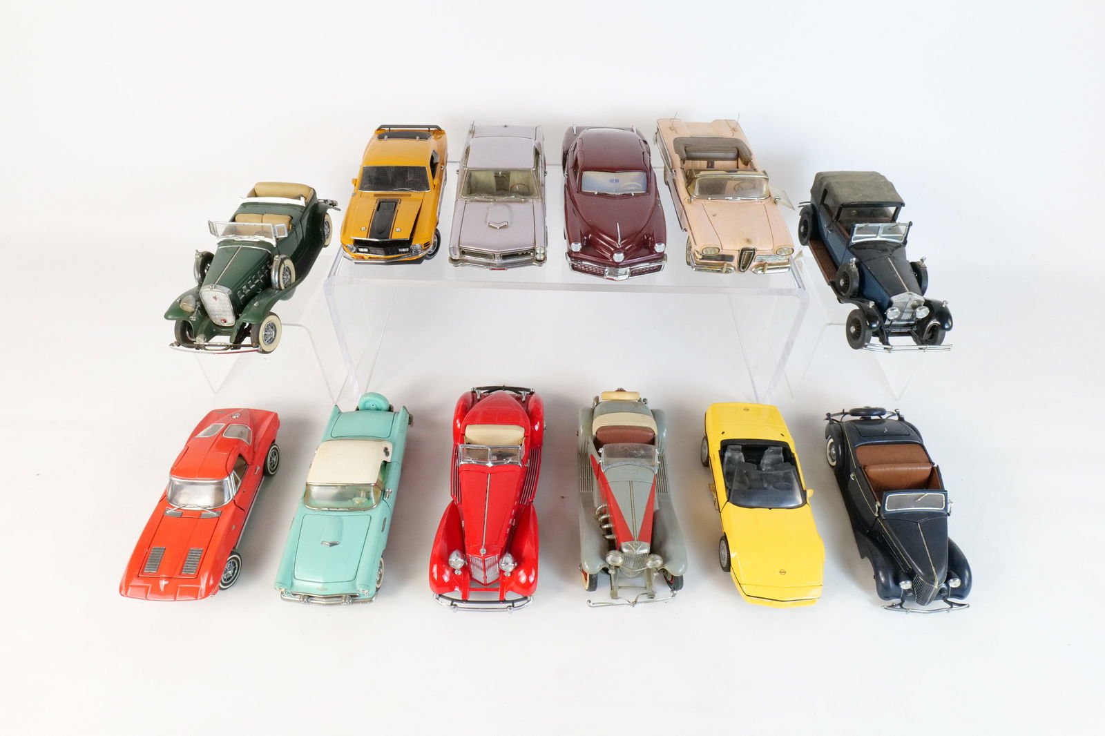 Lot of 12 Assorted 1:24 Scale Diecast Cars: Lot of 12 Assorted 1:24 Scale Diecast Cars. Mostly Franklin and Danbury Mint. Including 1948 Tucker, 1986 Corvette, 1970 Ford Mustang Mach 1, 1965 Pontiac GTO, 1963 Corvette, and More. Full Disclosure
