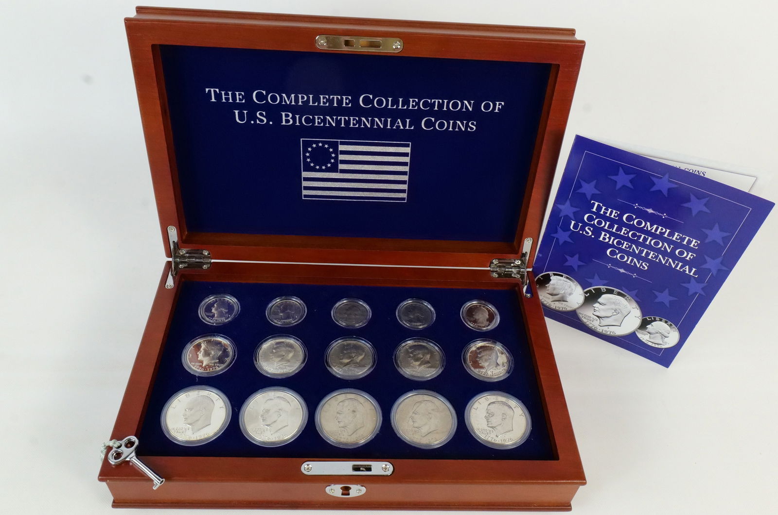 US 1776-1976 Bicentennial Coin Collection: A collection of fifteen United States Bicentennial coins produced by the San Francisco, Philadelphia, and Denver Mints. This set, distributed by PCS Stamps and Coins, includes five Eisenhower