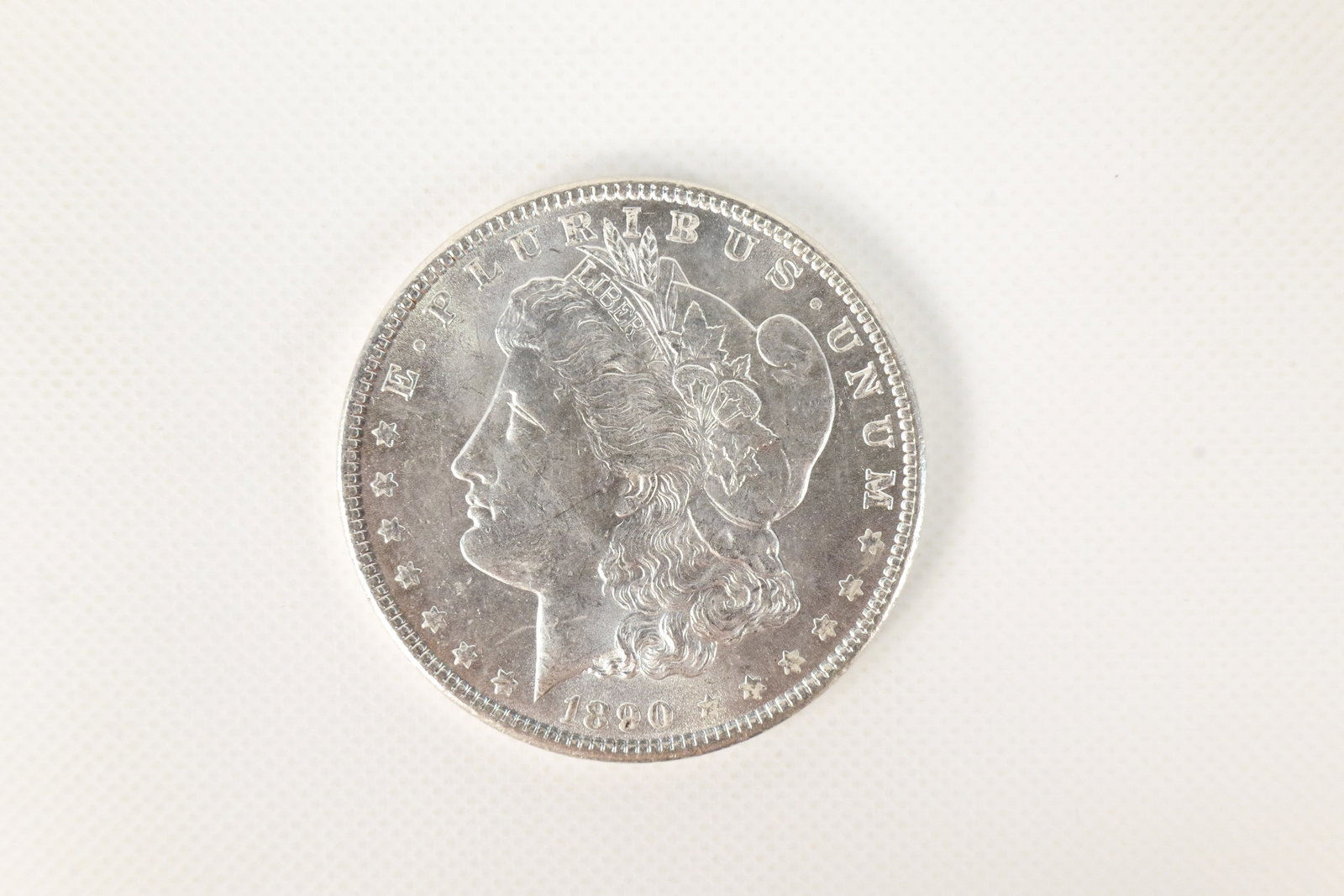 US 1890 Morgan Silver Dollar: 1890 Morgan Silver Dollar. In excellent condition. Catalog number KM-110. Designer George T. Morgan. Philadelphia Mint. Liberty Head / Eagle reverse. All invoices must be paid within 24 hours of the s