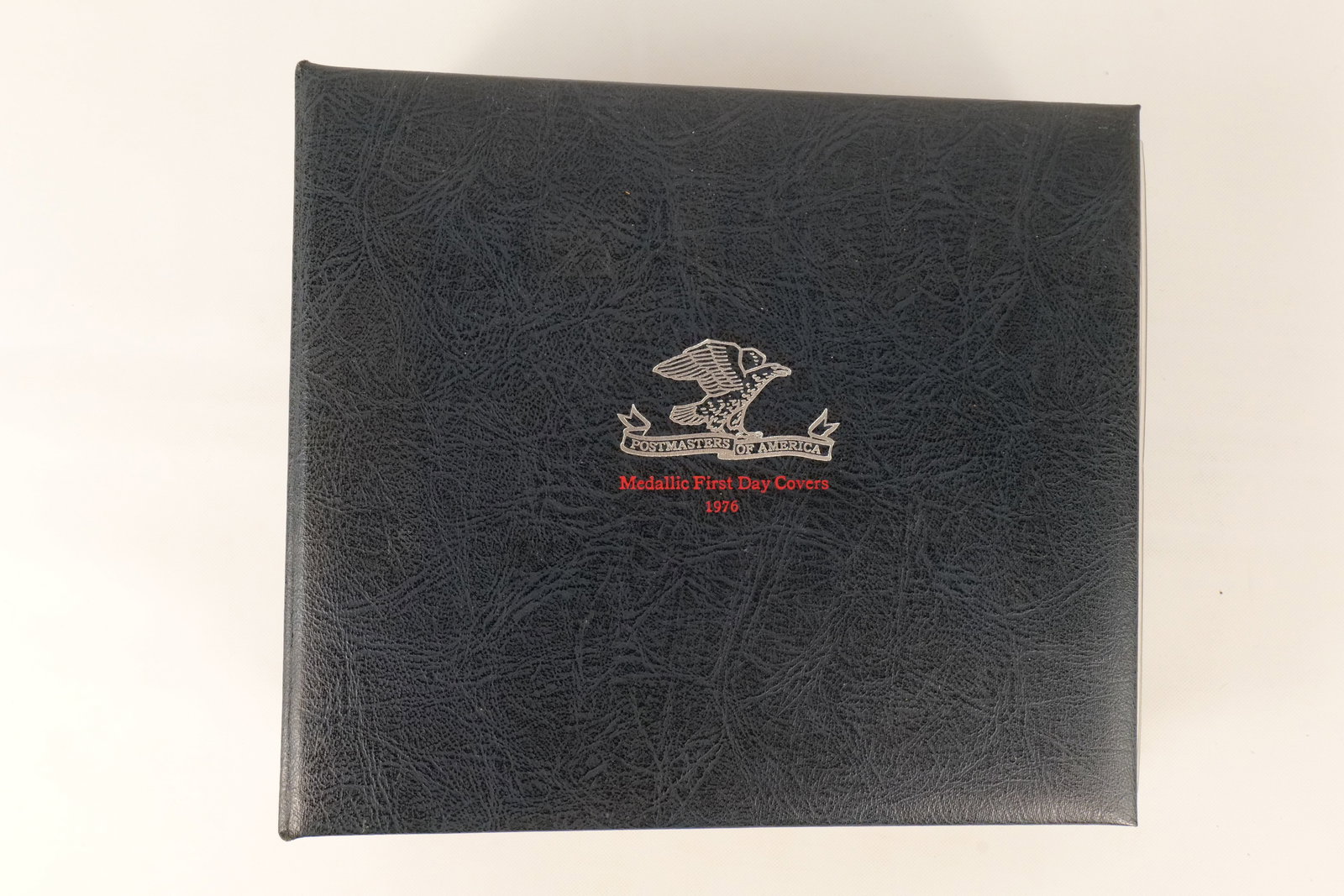 US 1974-1976 Postmasters of America Sterling Medallic First Day Covers: A collection of medallic first day covers issued by the Postmasters of America and minted by The Franklin Mint. The series consists of sterling silver proof medals paired with matching United States p